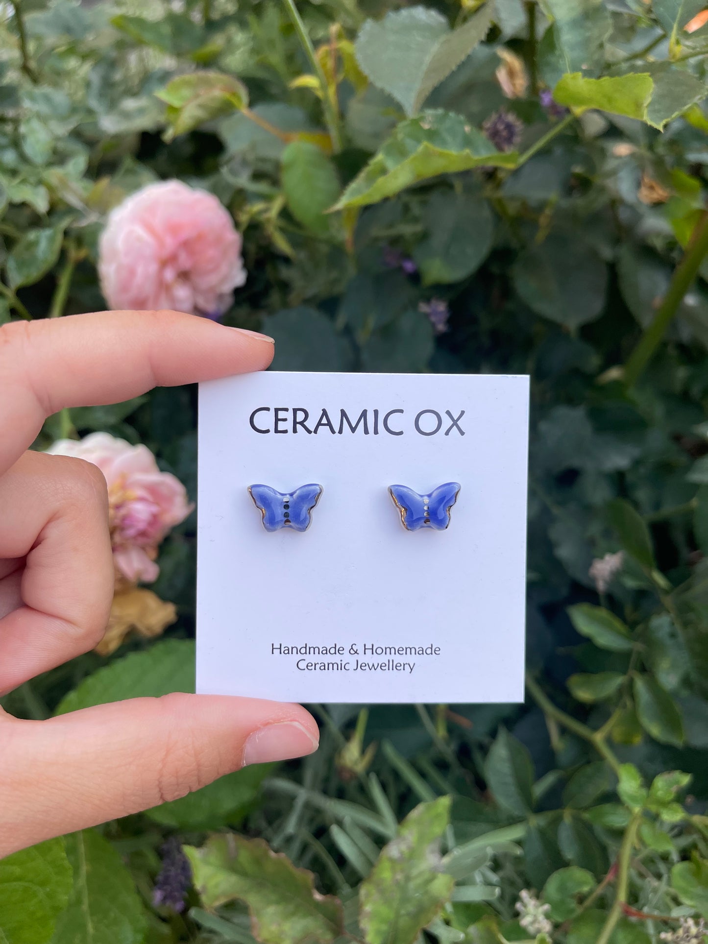 Blue butterfly studs with silver detail