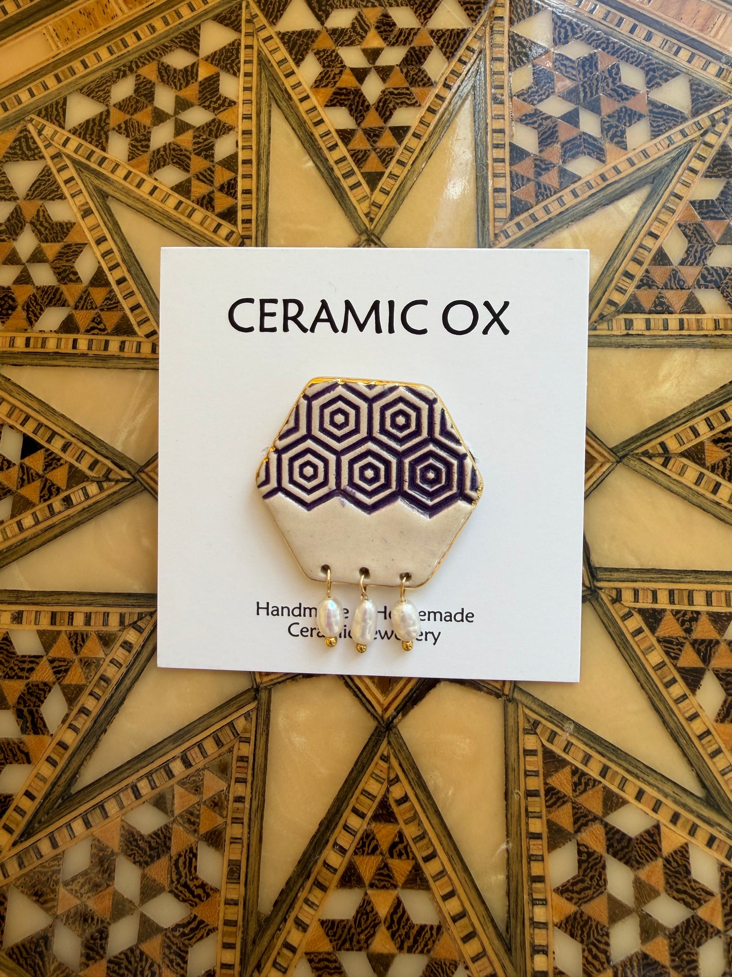 Hexagon brooch with dark purple and freshwater pearls