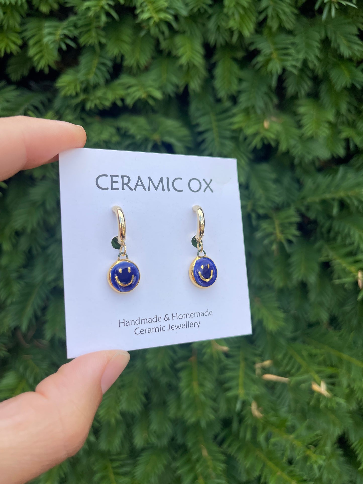 Cobalt smiley face hoops