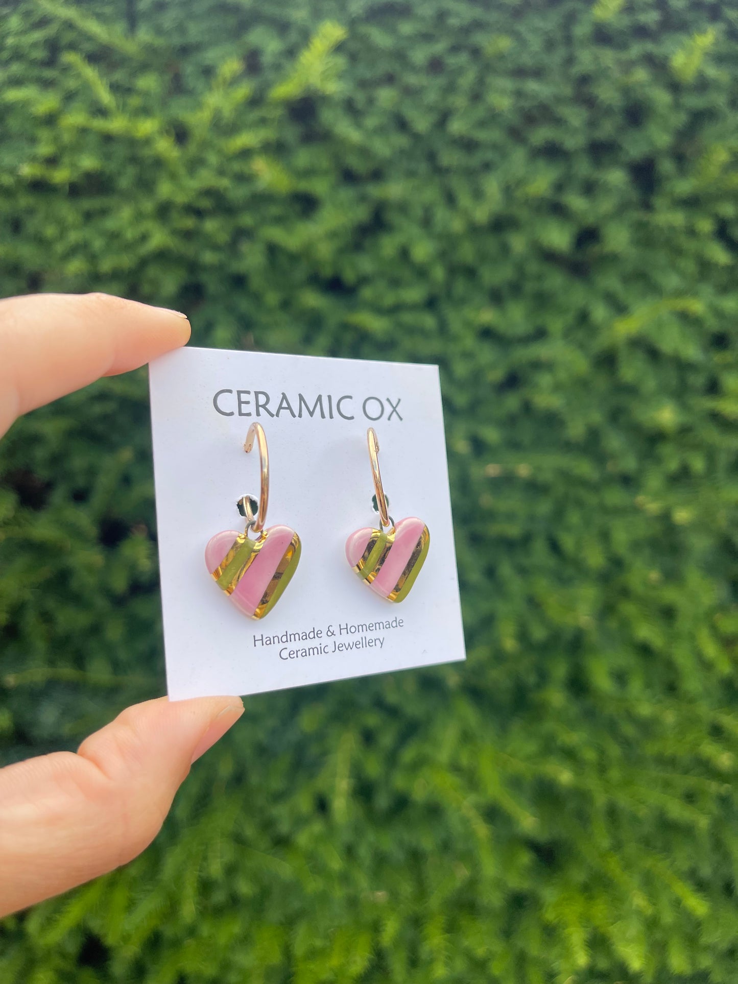 Olive pink striped hearts on hoop studs