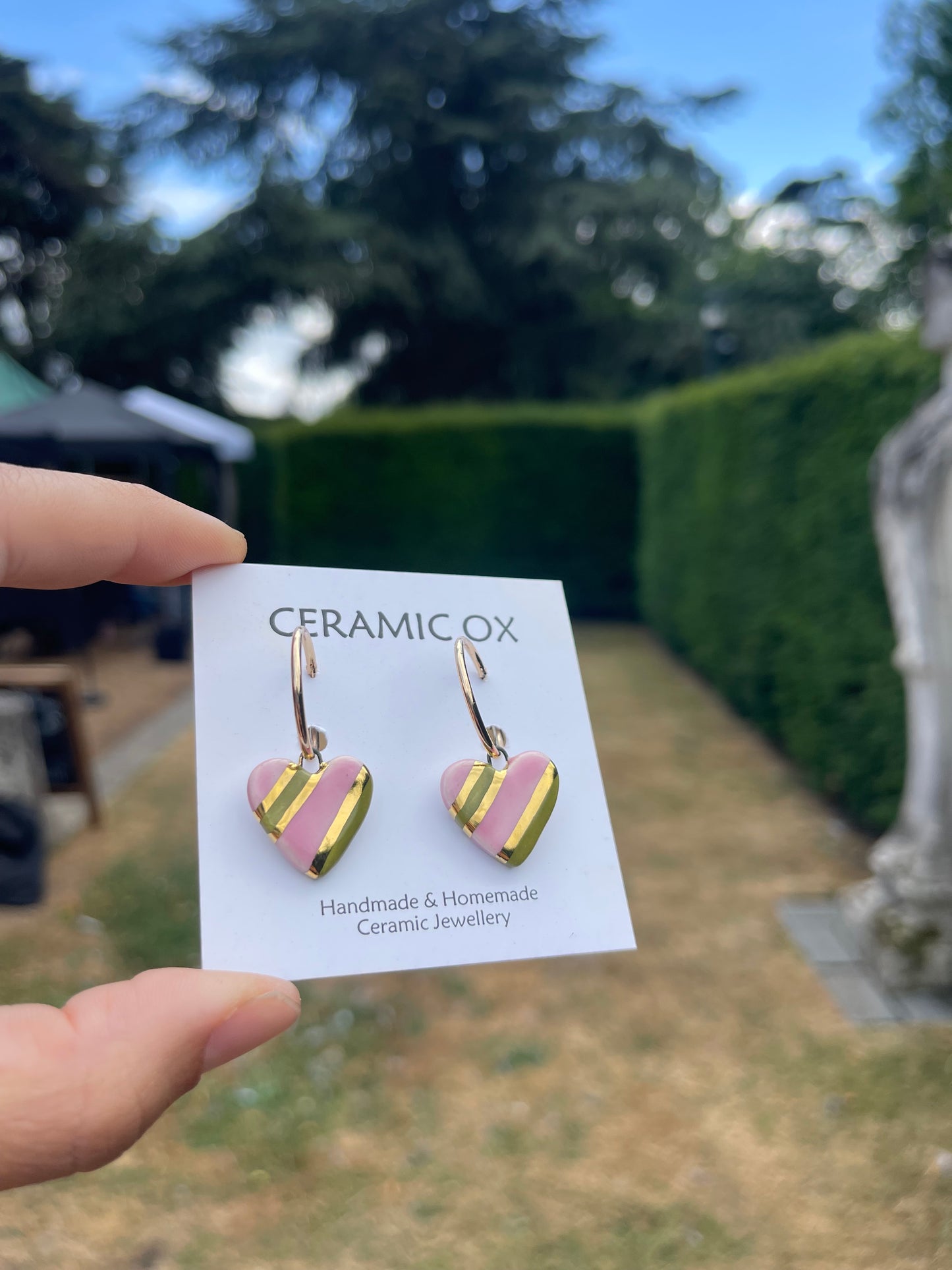 Olive pink striped hearts on hoop studs