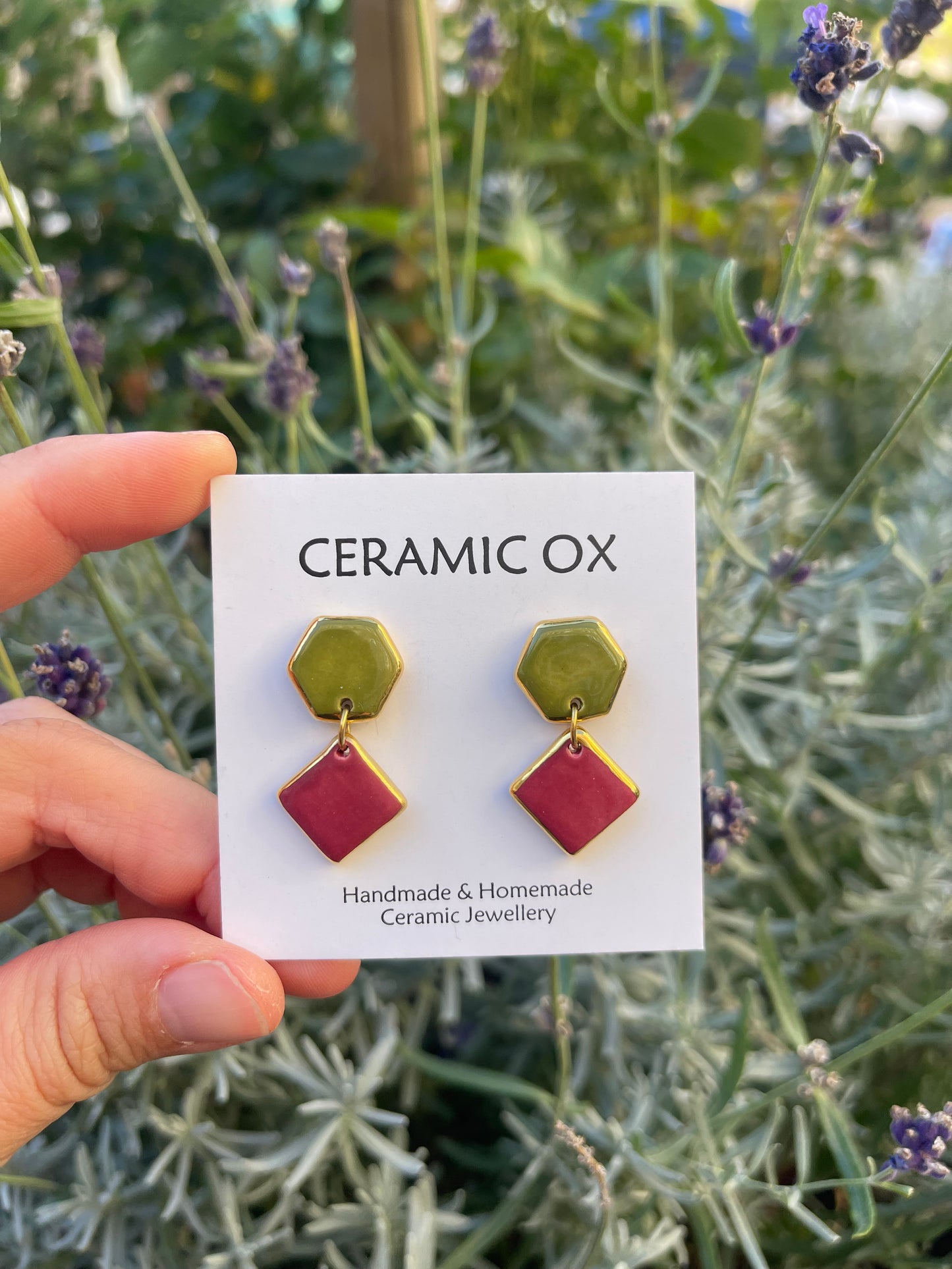 Raspberry Olive geometric dangle studs.