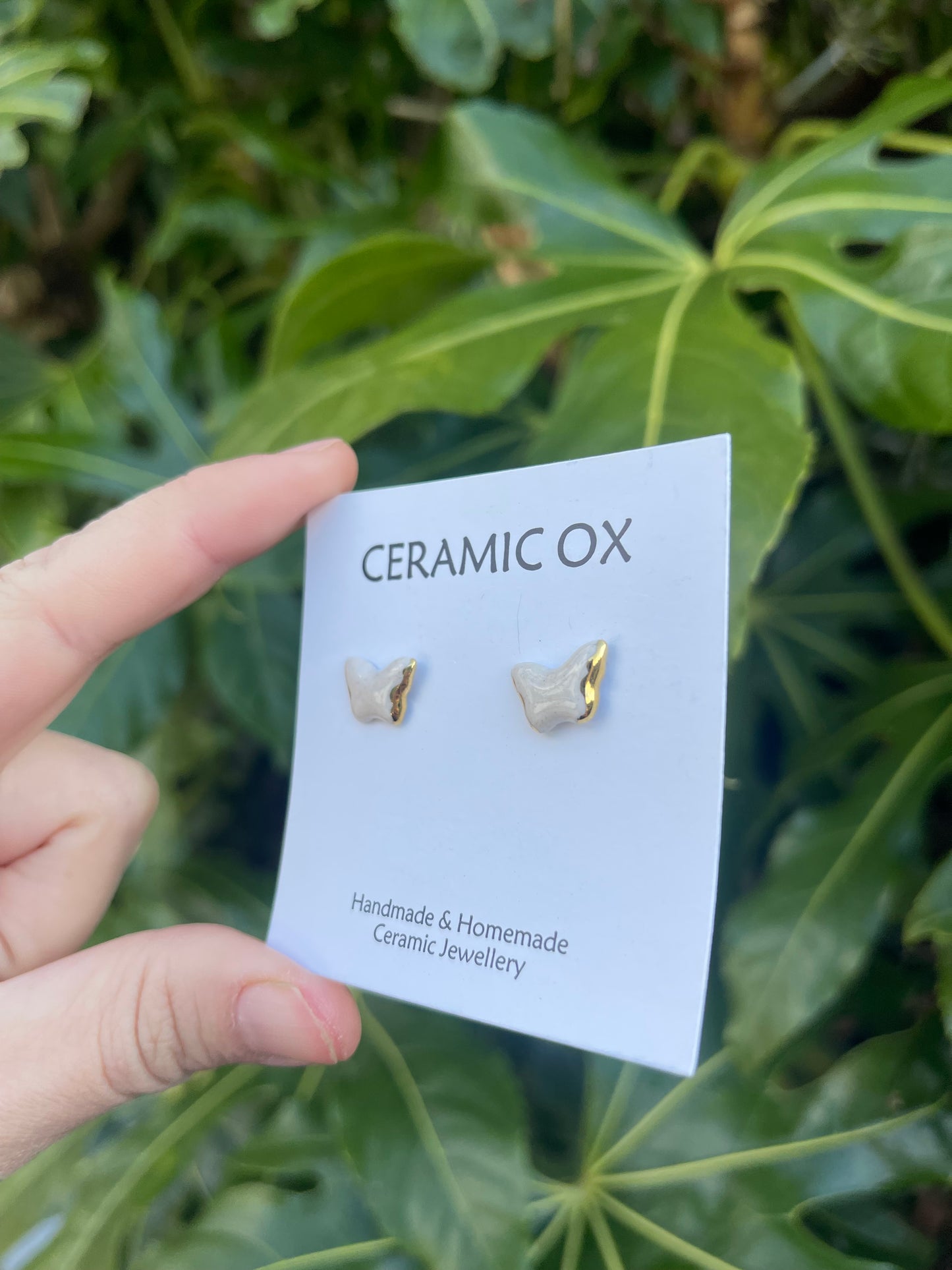 White butterfly studs