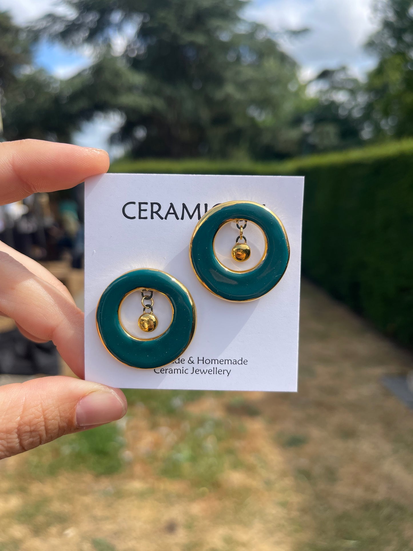Teal studs with ceramic dangle