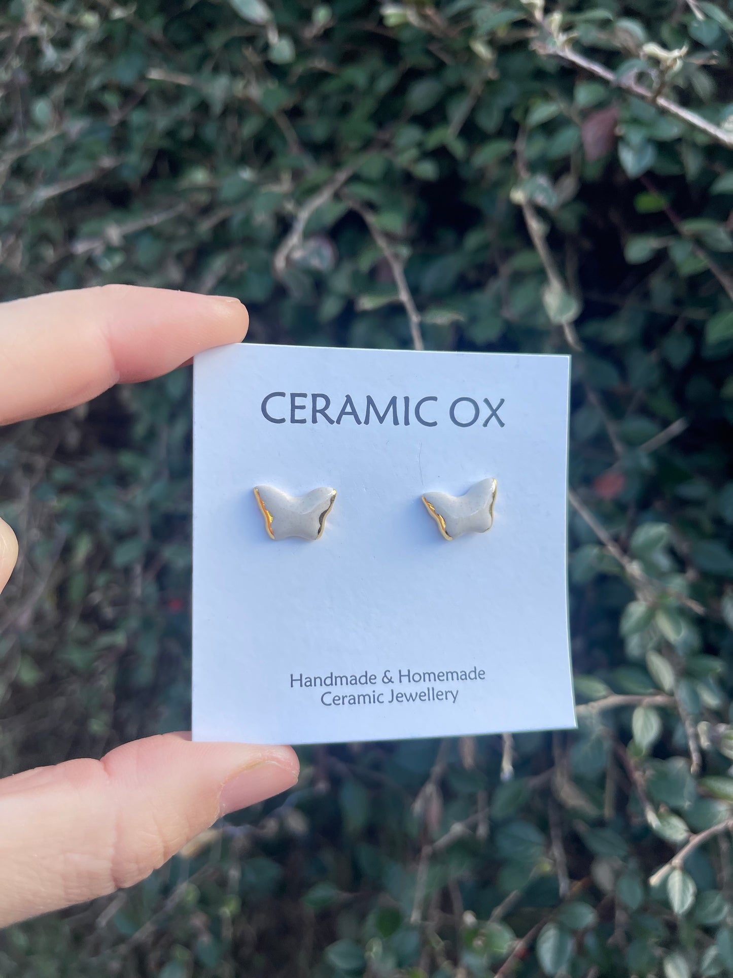 White butterfly studs
