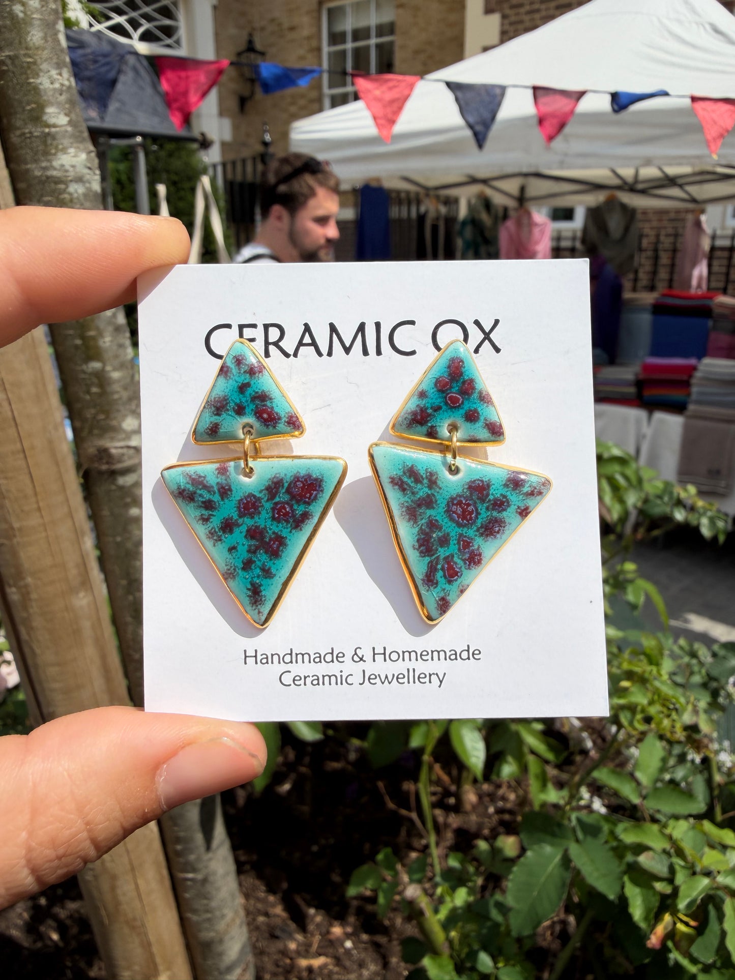 Speckled double triangle dangly studs