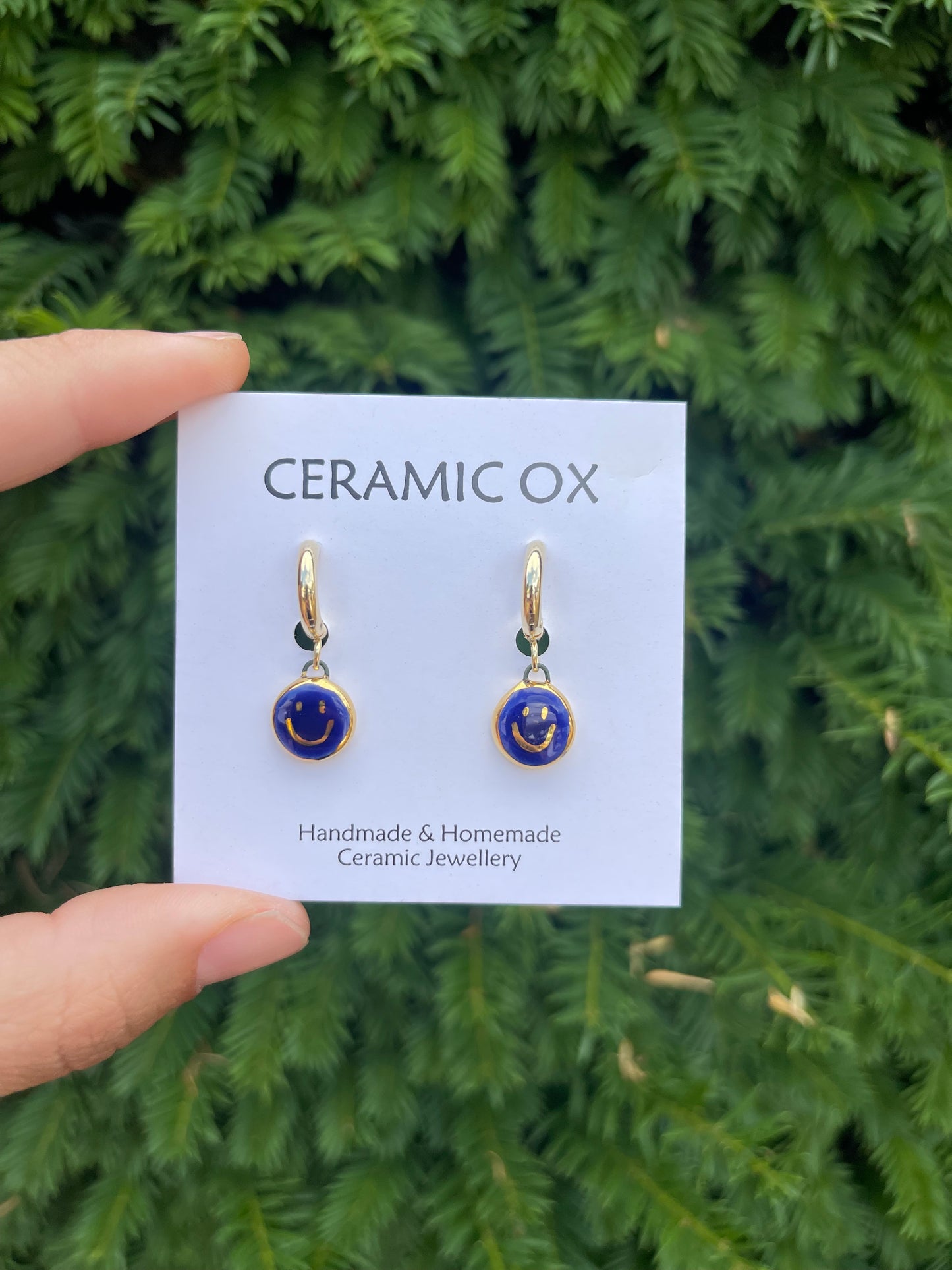 Cobalt smiley face hoops