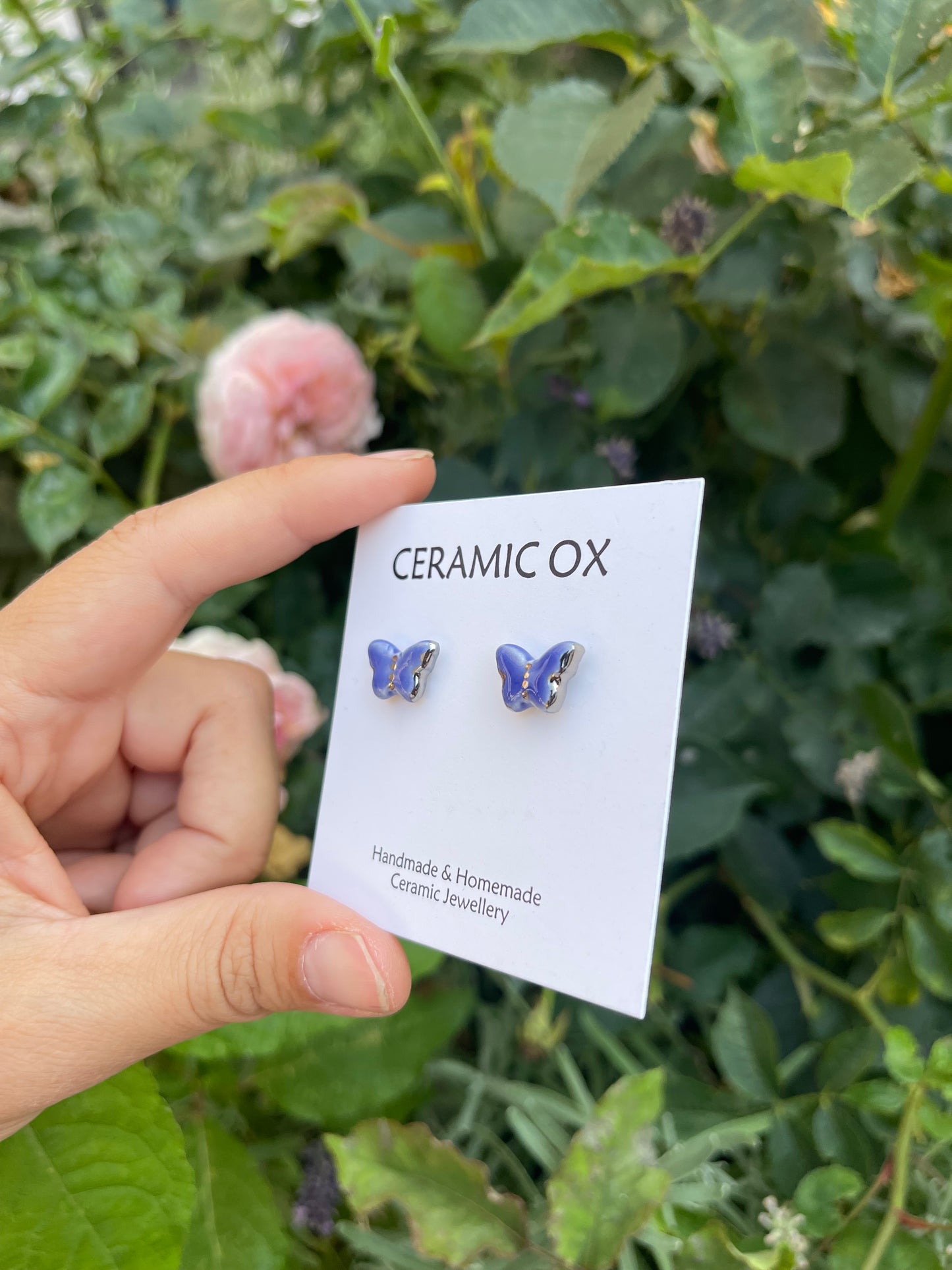 Blue butterfly studs with silver detail