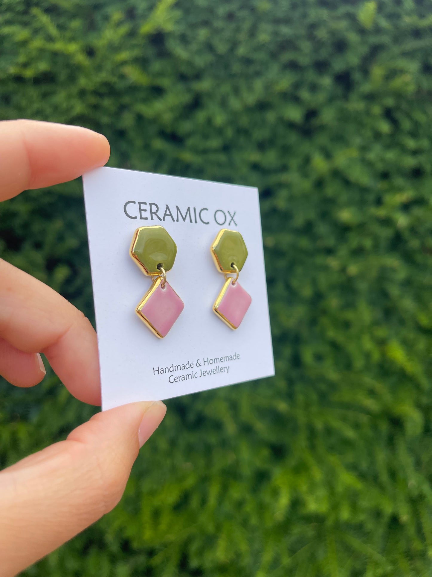 Olive/pink geometric dangly studs