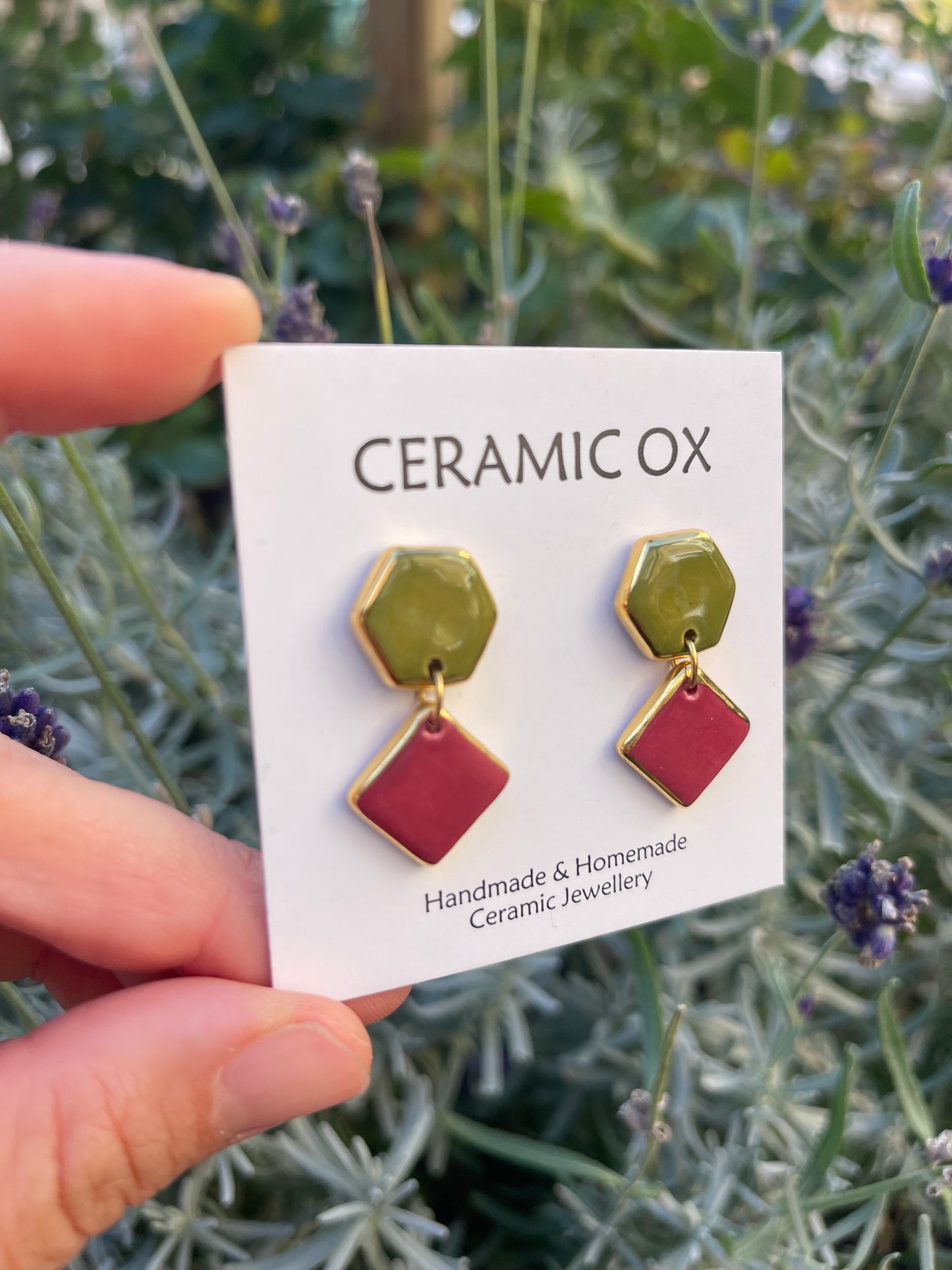 Raspberry Olive geometric dangle studs.