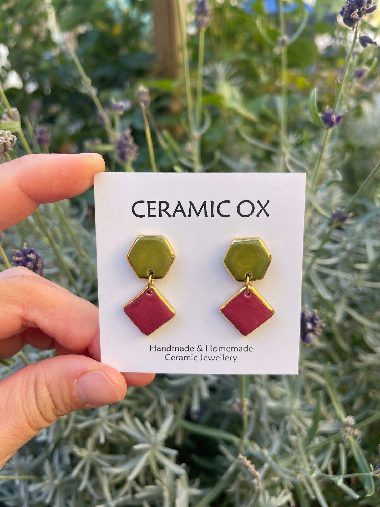 Raspberry Olive geometric dangle studs.