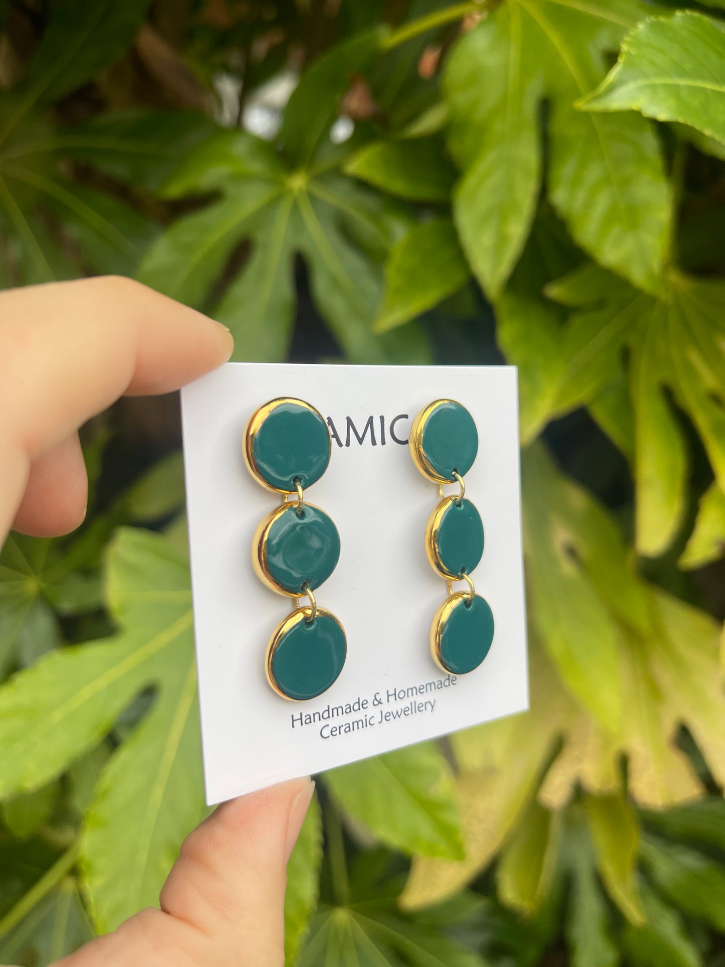 Teal green triple circle dangly studs