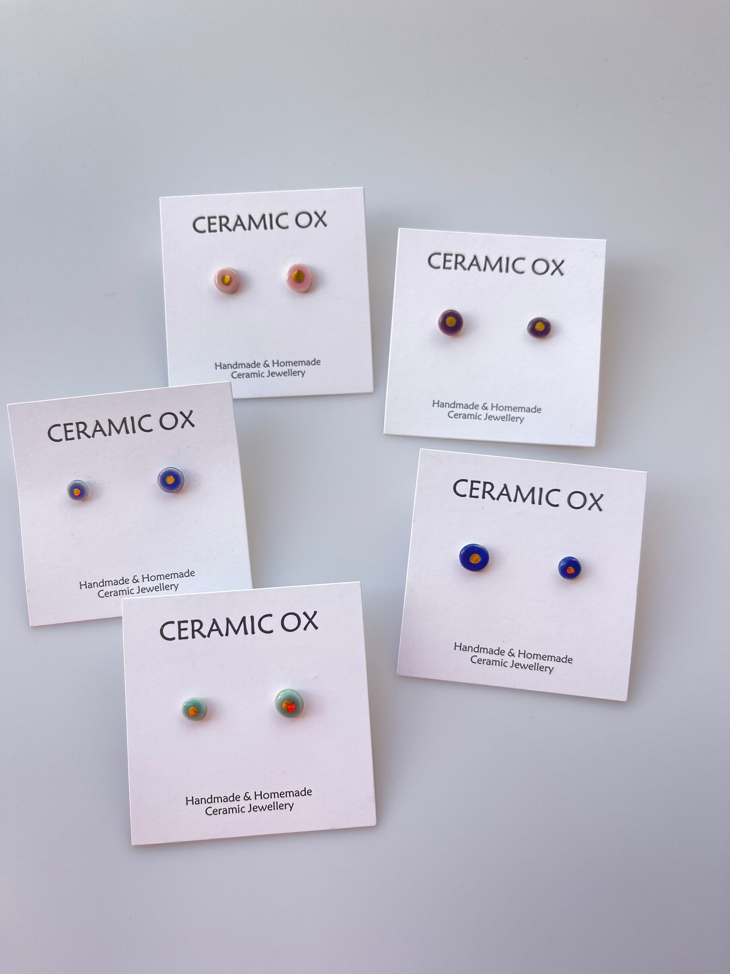 Tiny gold dot studs
