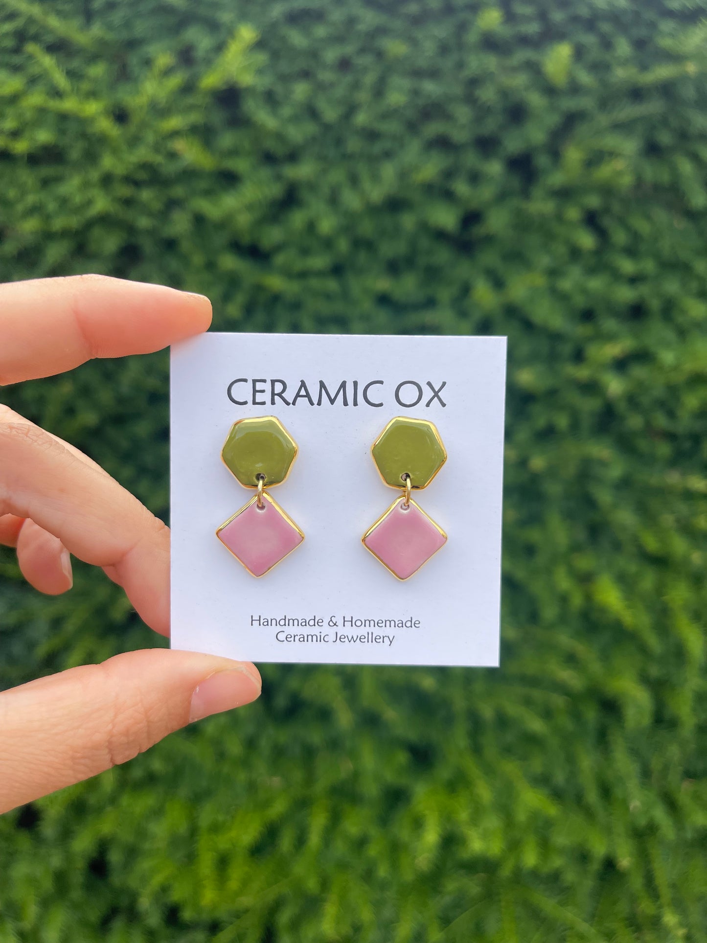 Olive/pink geometric dangly studs