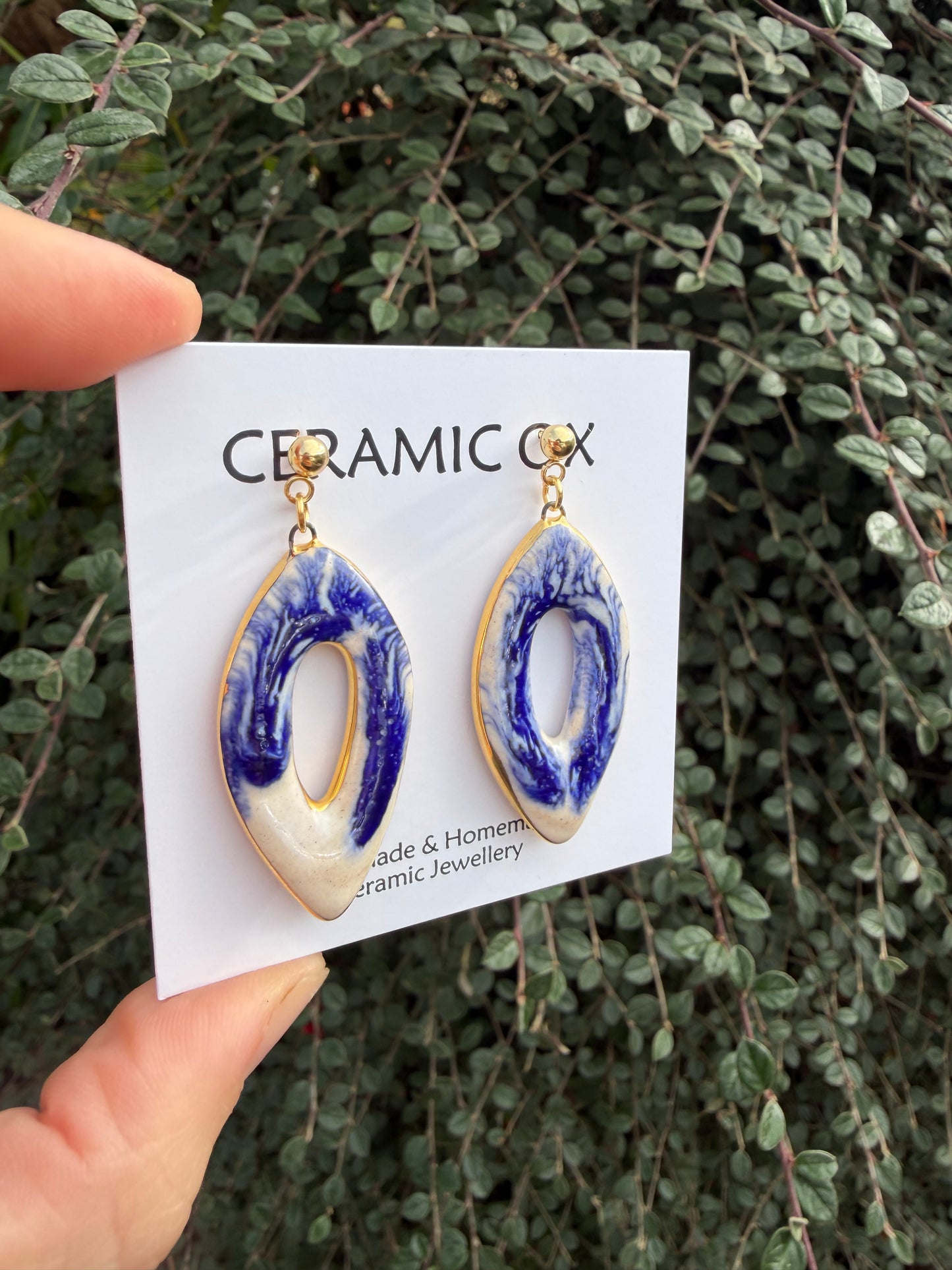 Blue dripping over white statement danglies