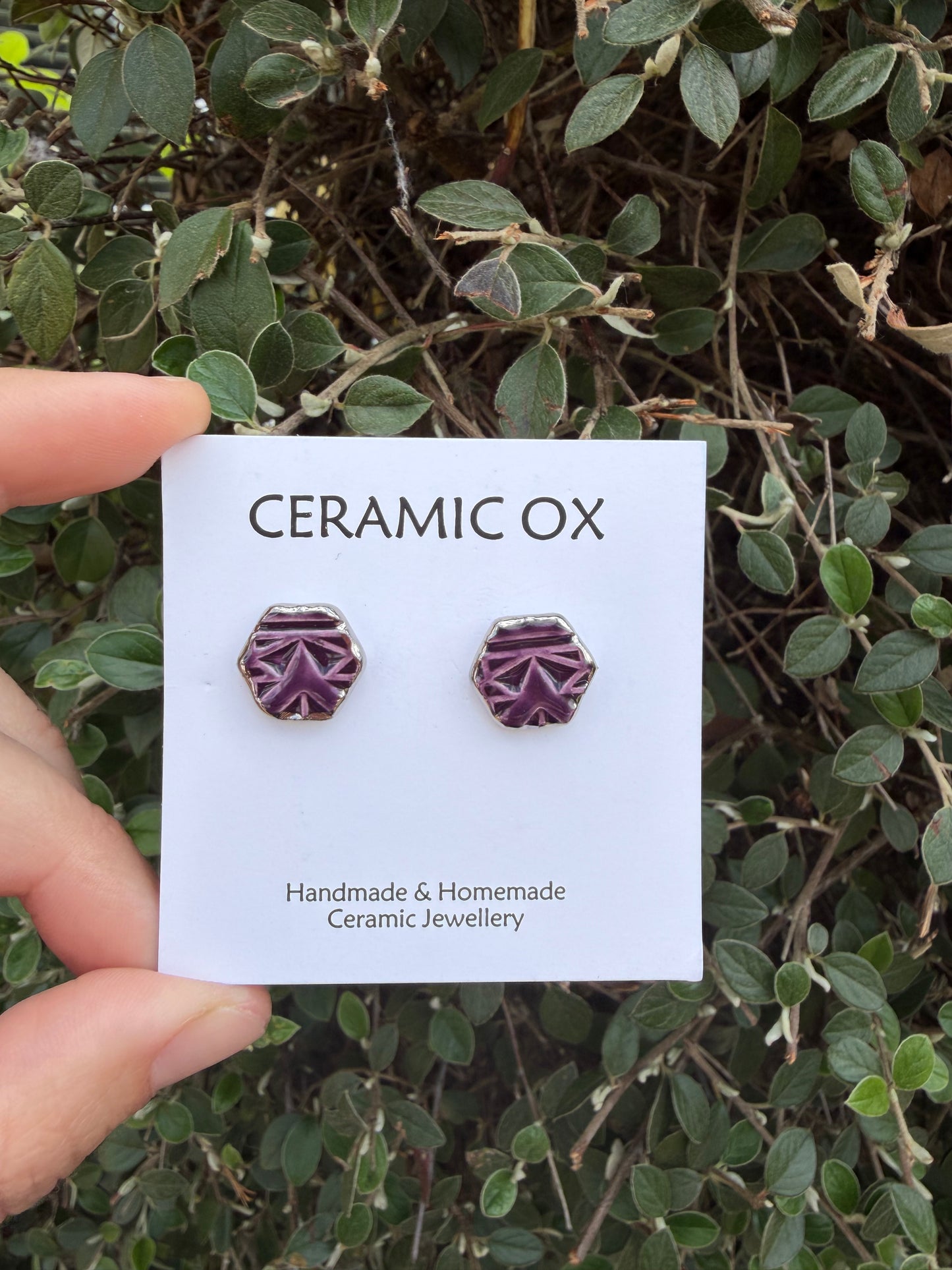 Royal purple hexagon geometric design studs with silver surround