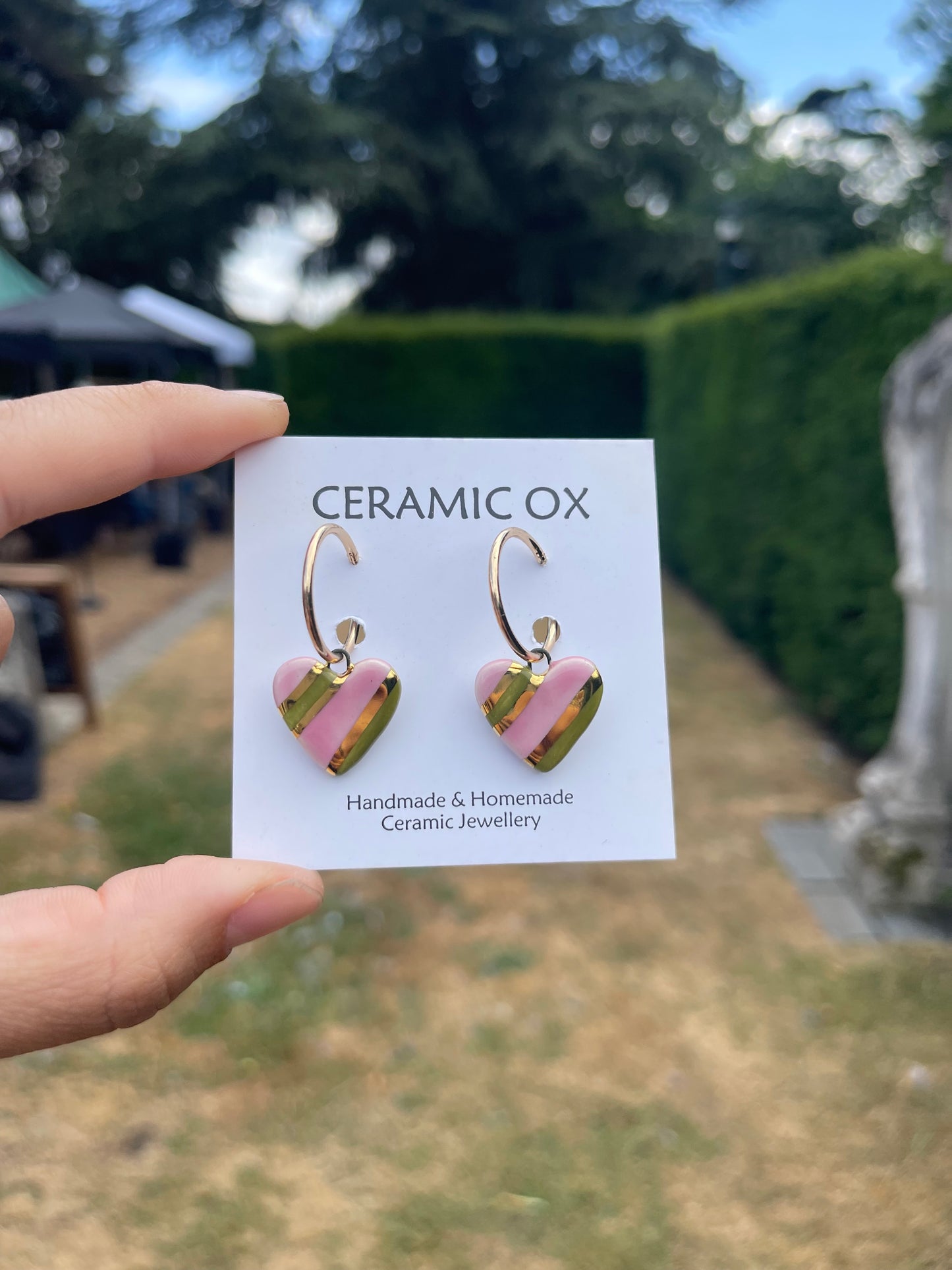 Olive pink striped hearts on hoop studs