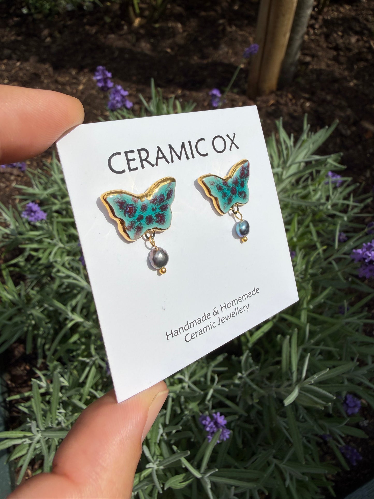 Speckled butterfly studs with grey fresh water pearls
