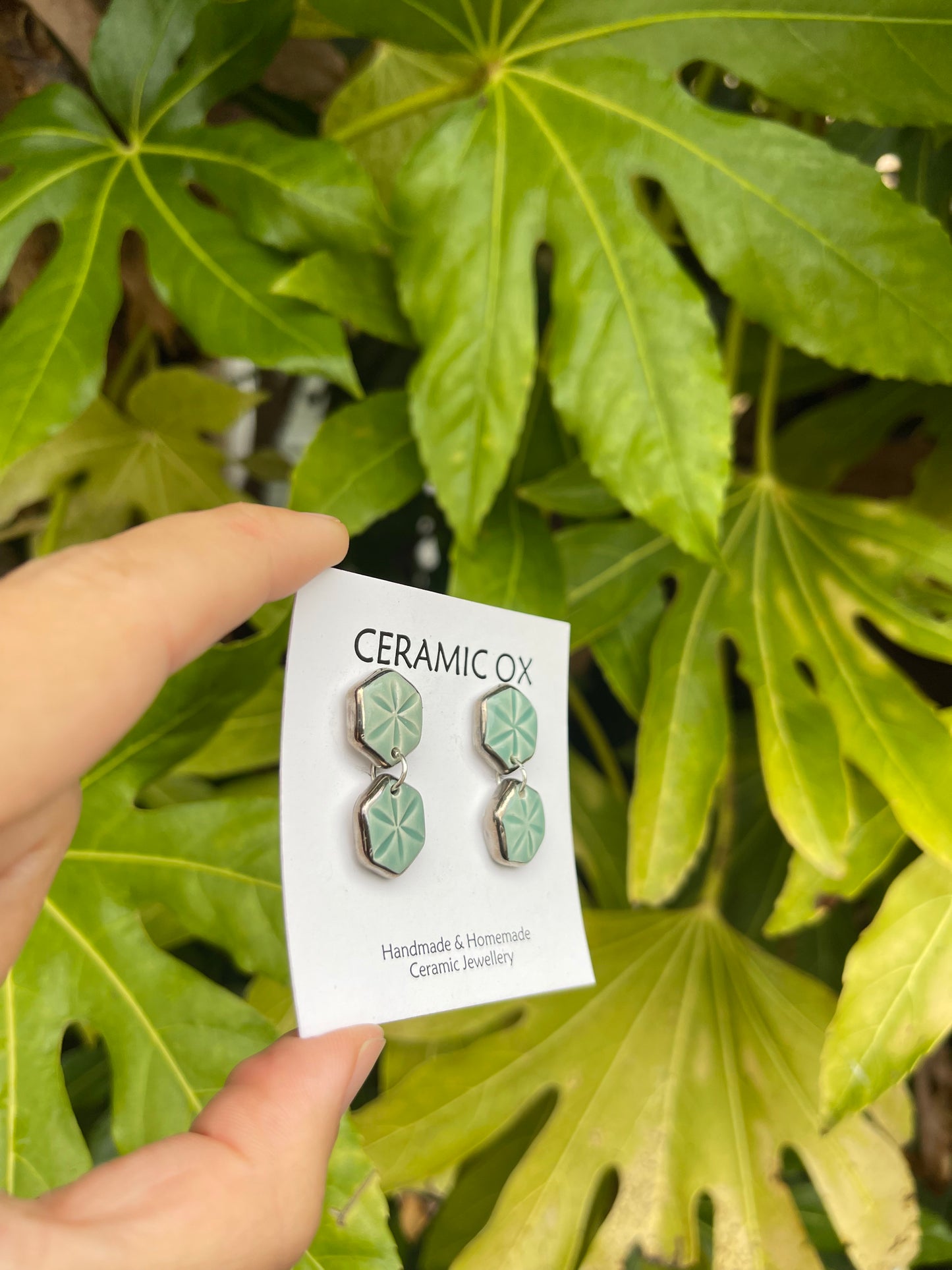 Jade hexagonal dangle studs with silver surround