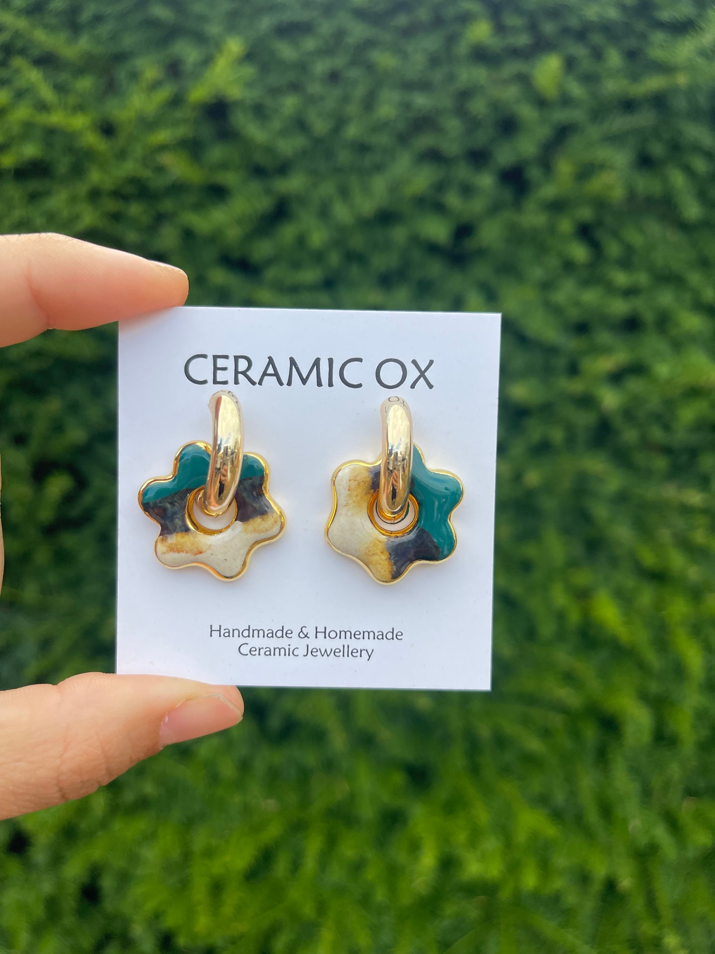 Flower charms on chunky hoops