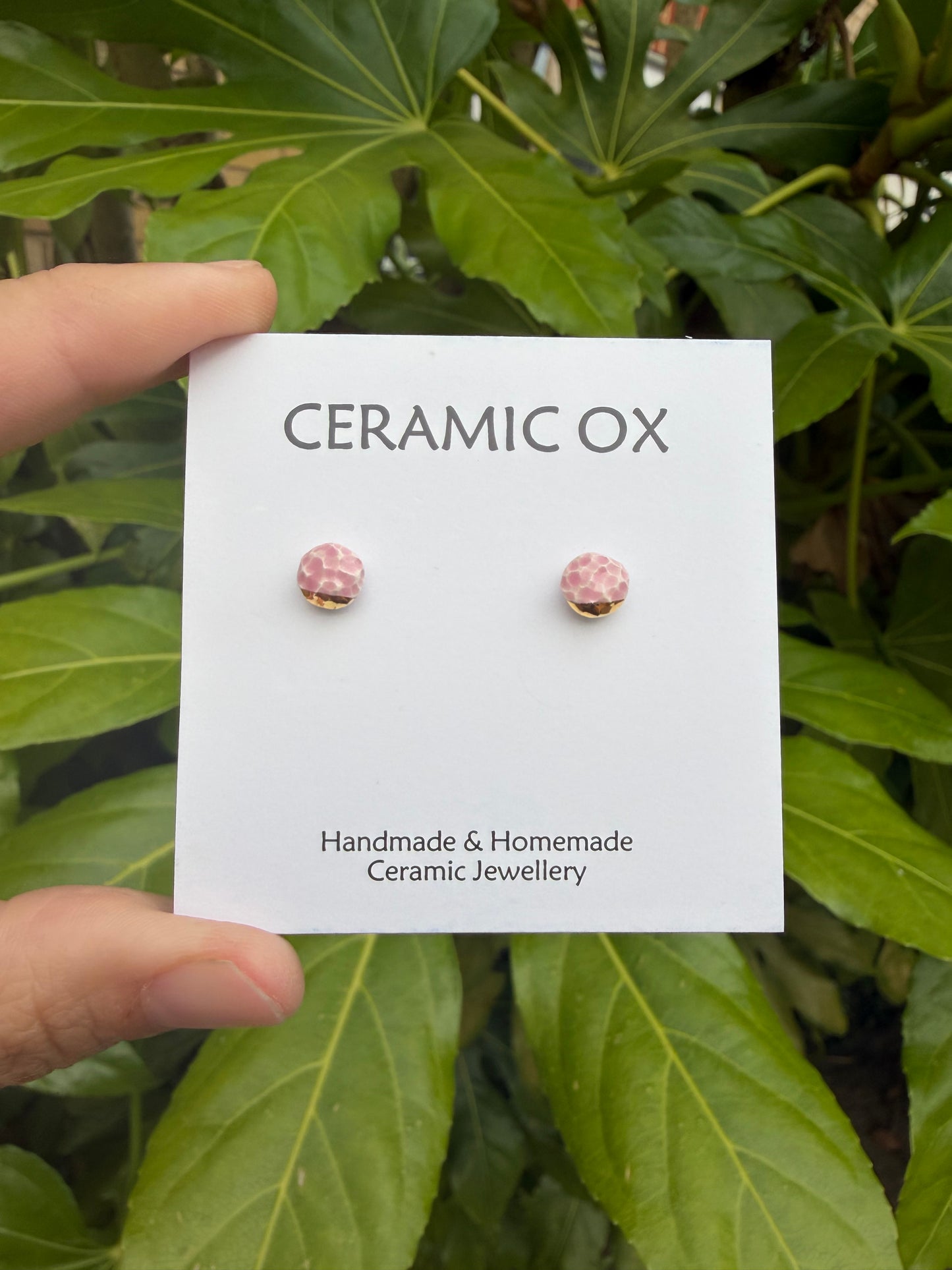 Tiny pink textured studs with gold accents