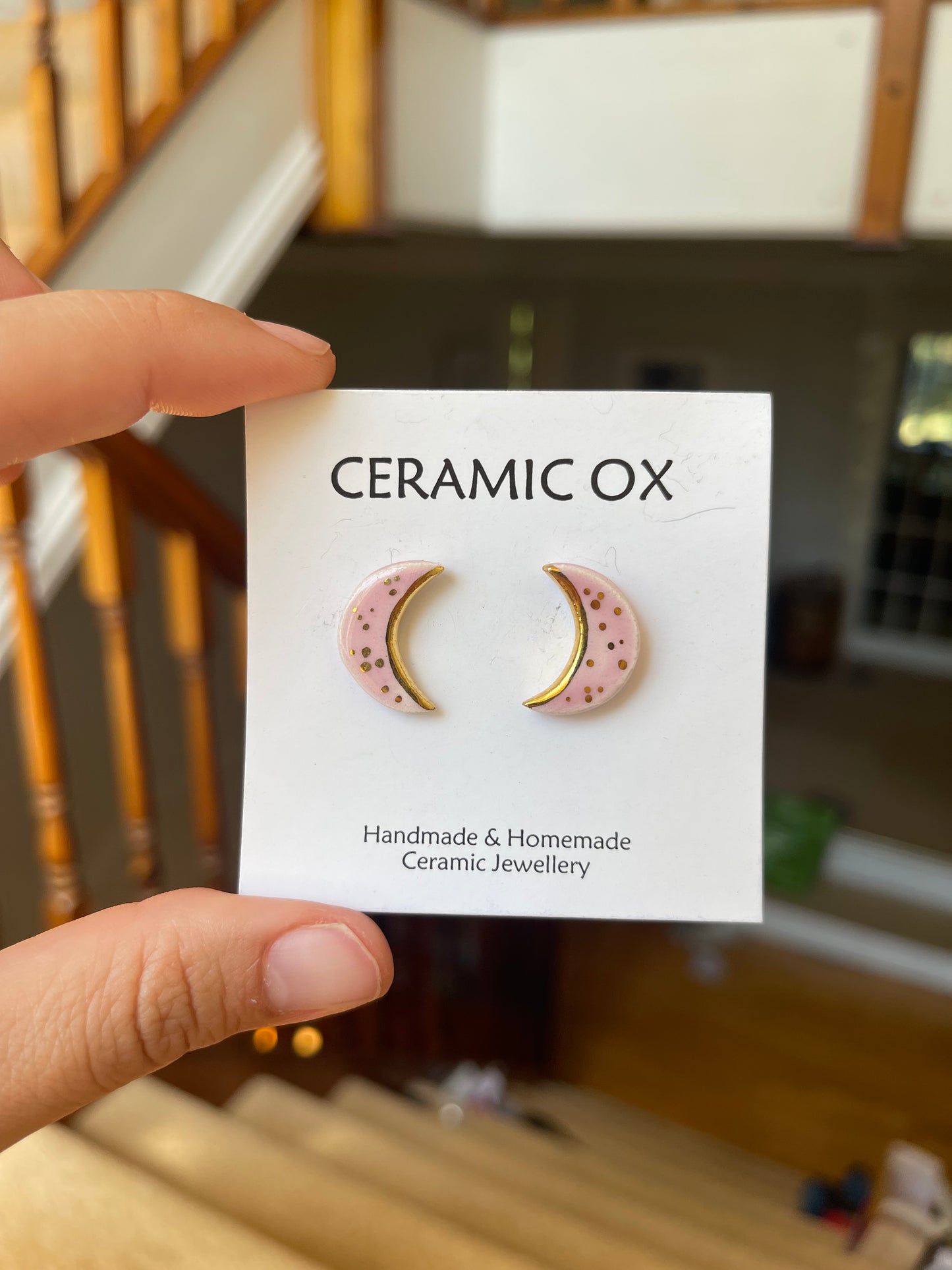 Pink crescent moon studs