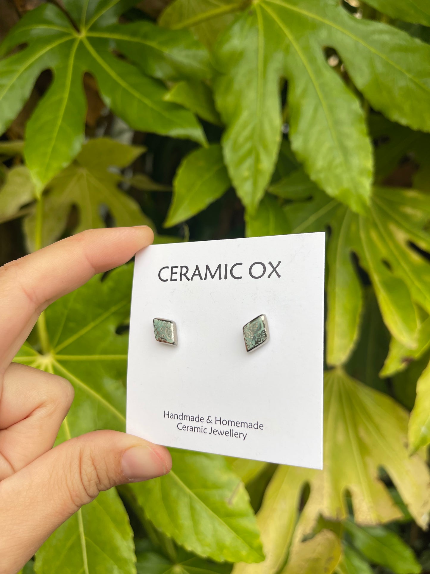 Tiny diamond studs with silver filigree style detailing