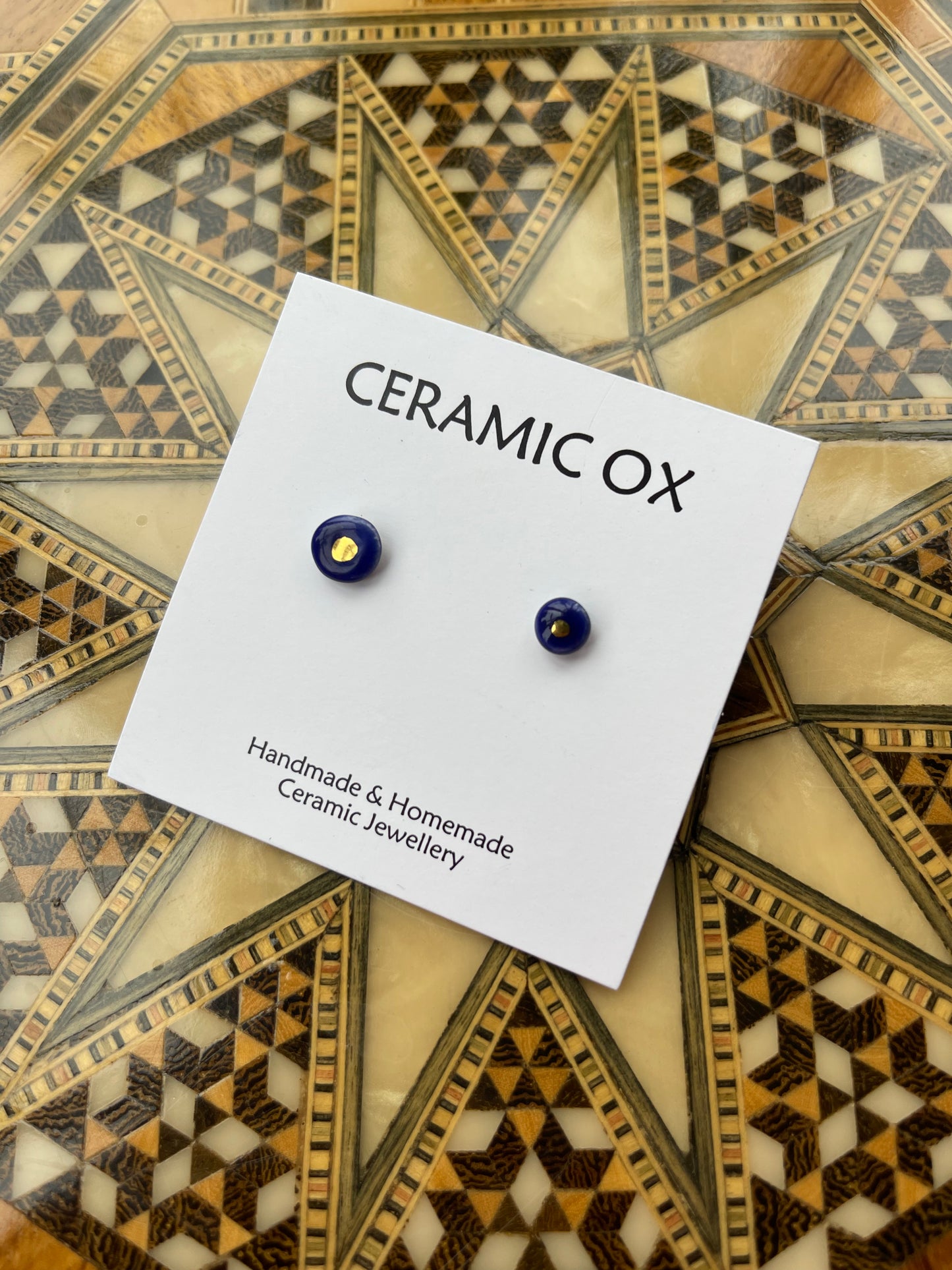 Tiny gold dot studs