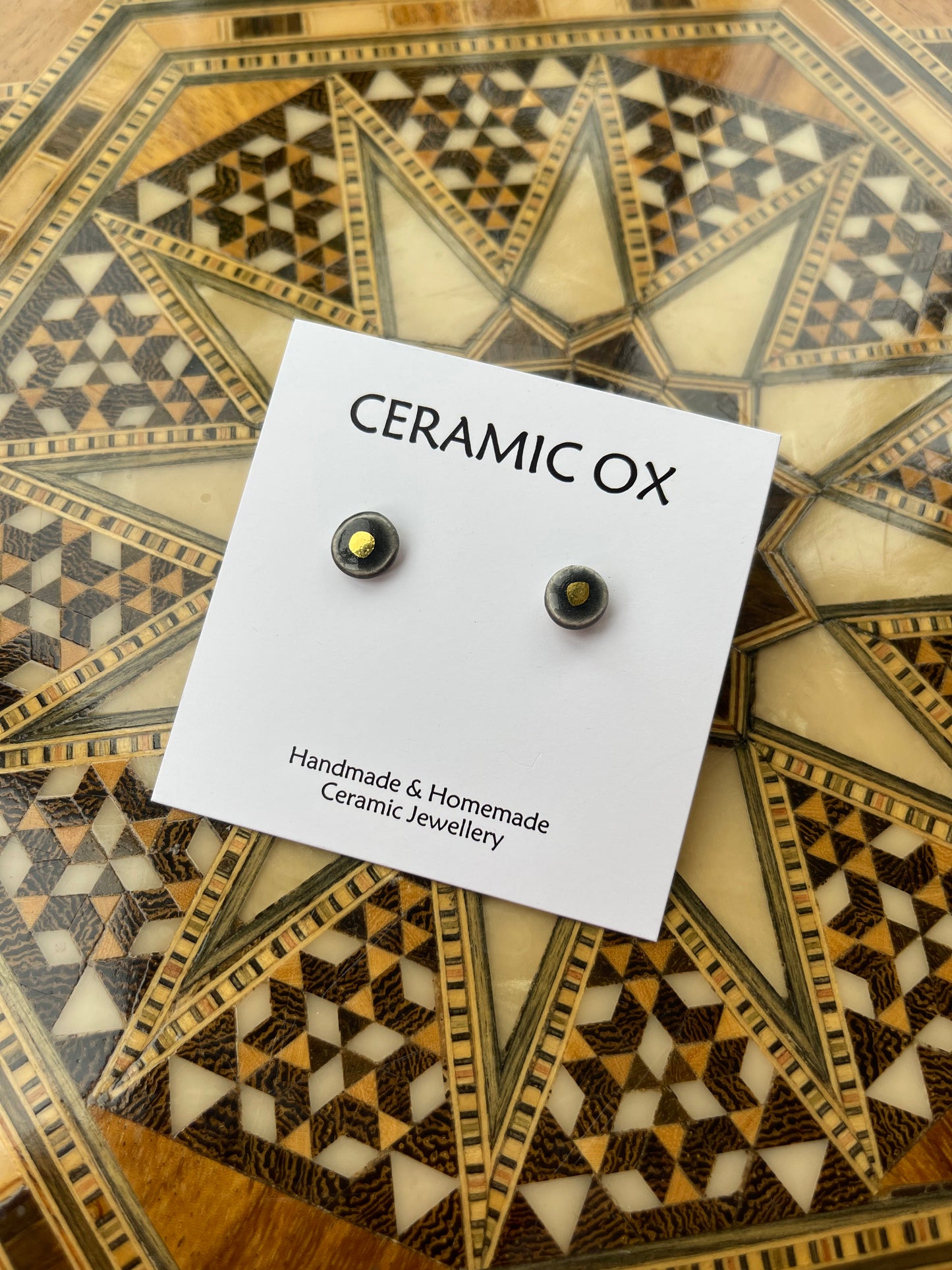 Tiny gold dot studs