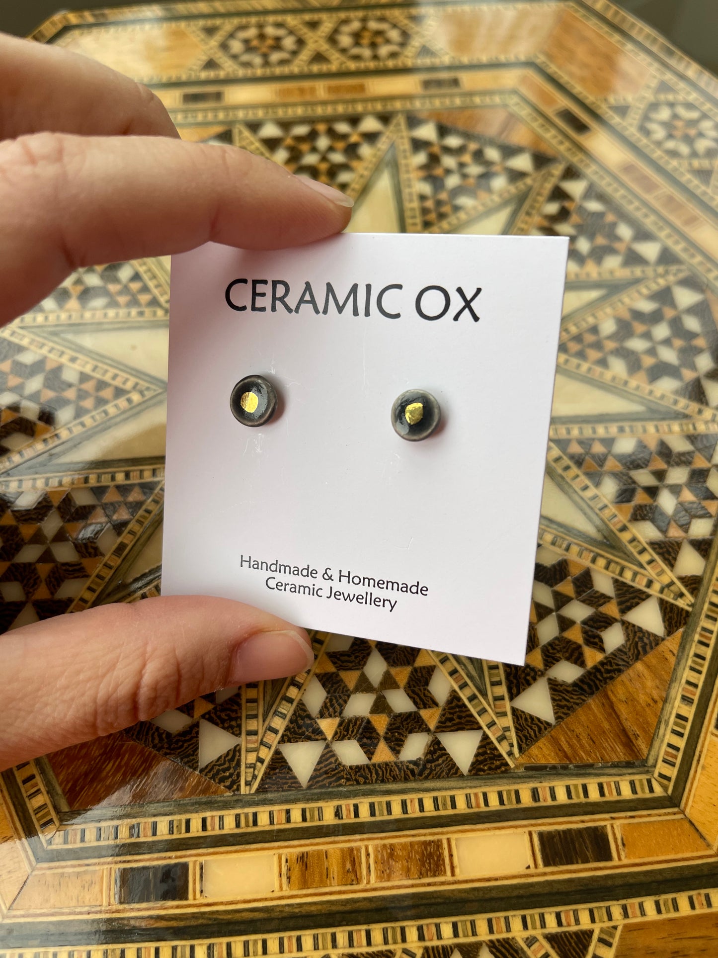 Tiny gold dot studs