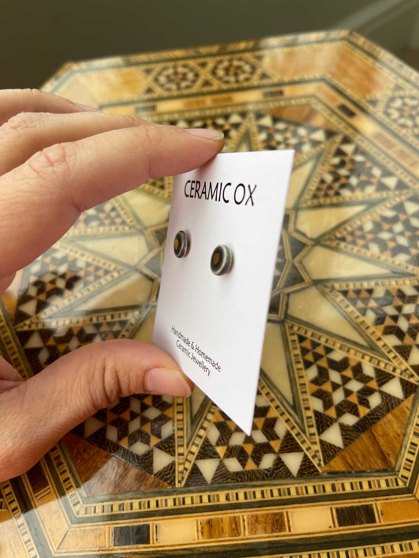 Tiny gold dot studs
