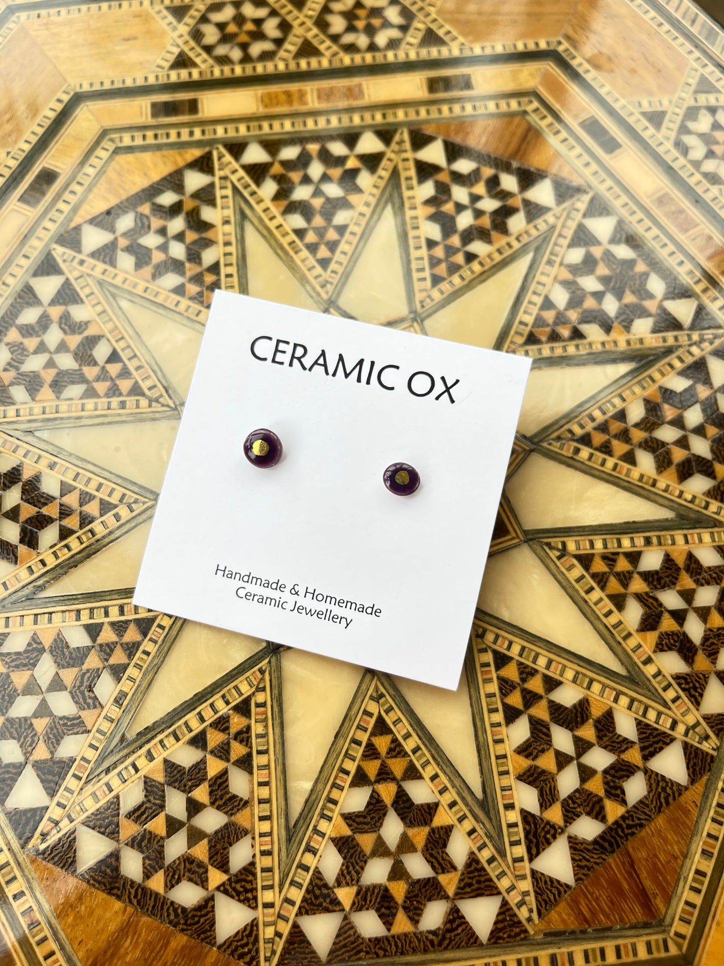 Tiny gold dot studs