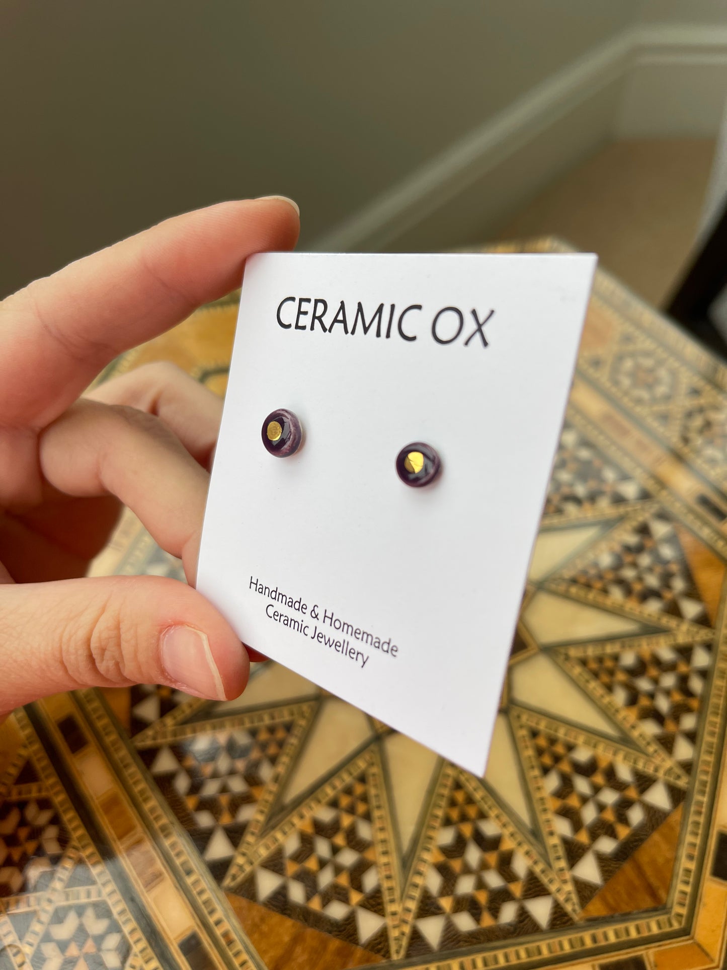 Tiny gold dot studs