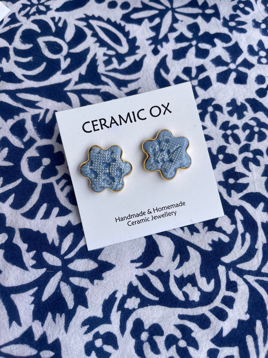 Baby blue lace imprint flower studs