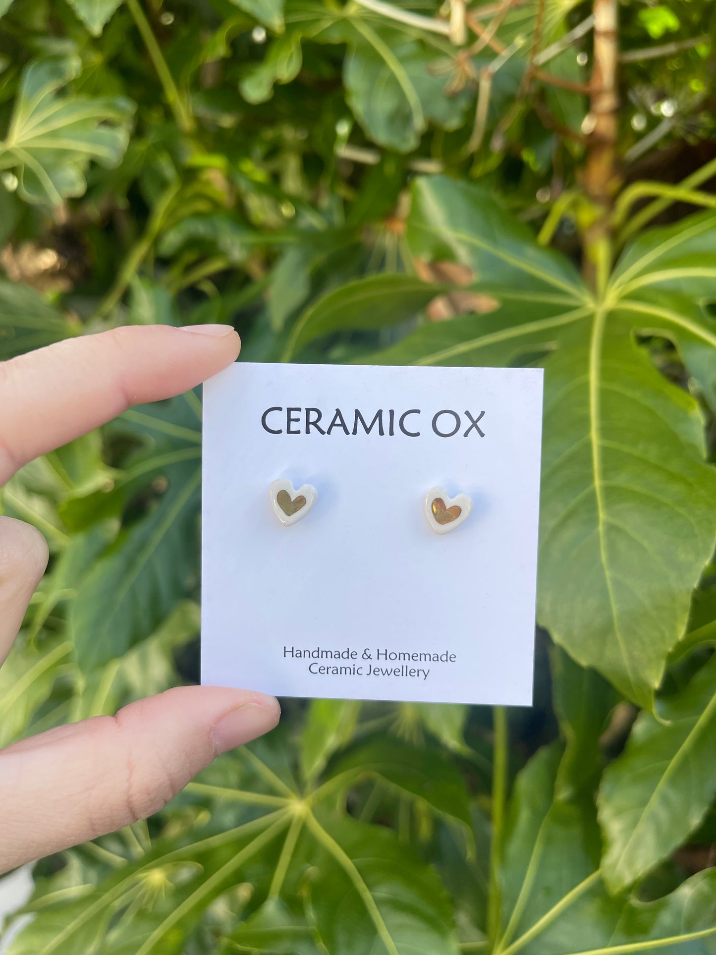 Tiny white heart studs