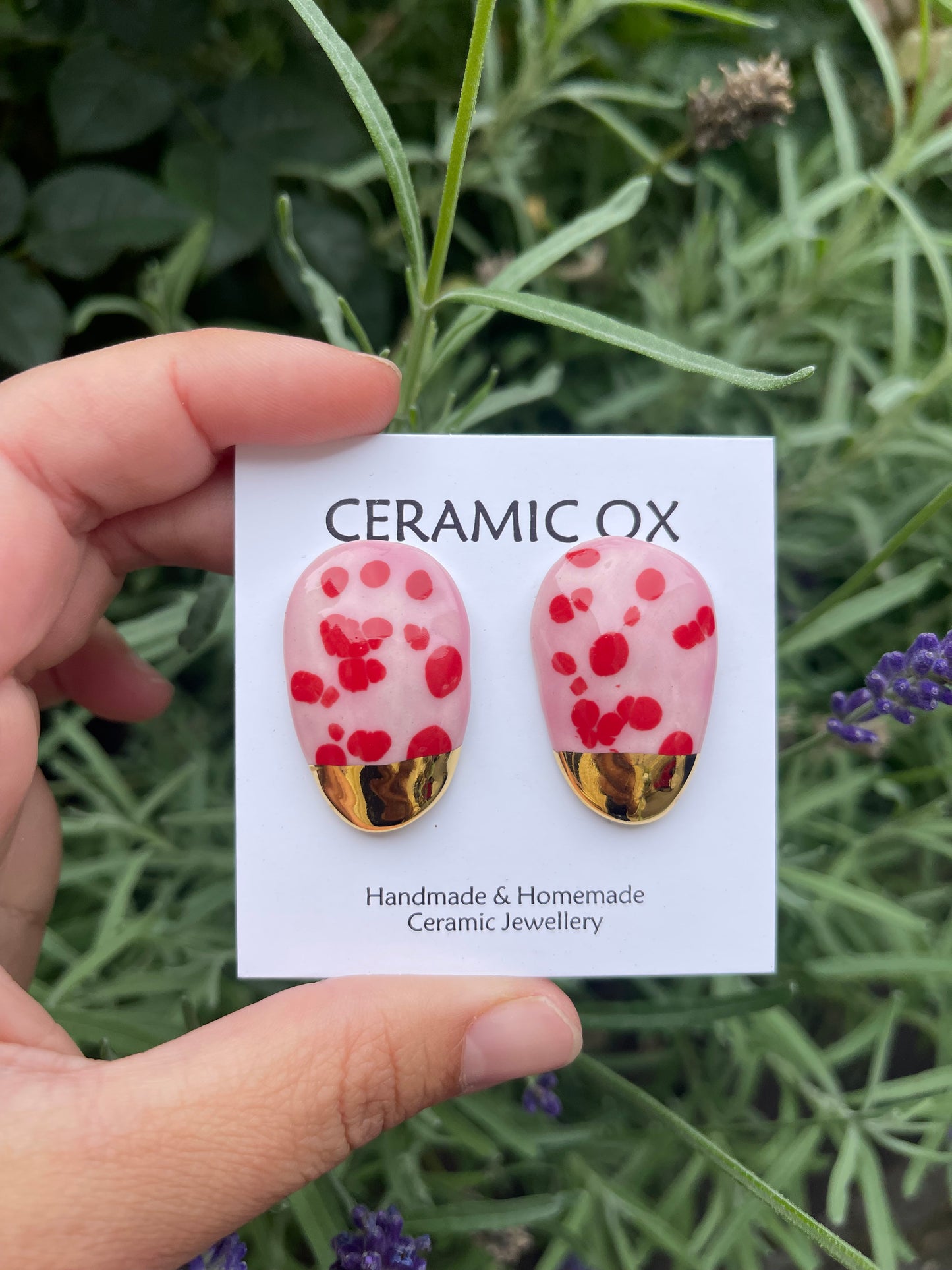 Pink/ red arched studs