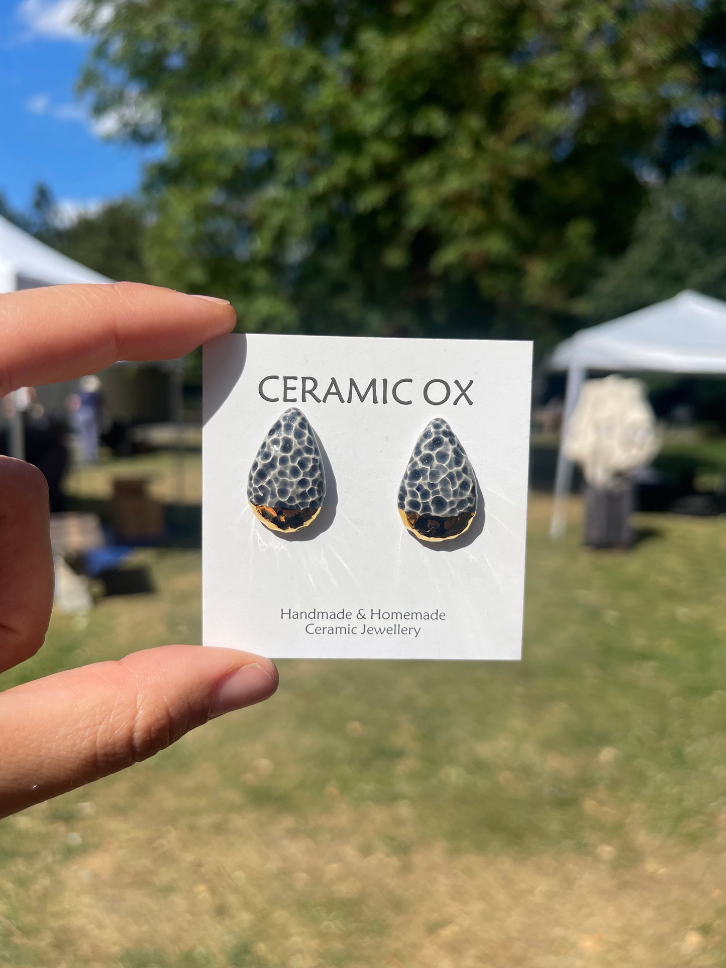 Textured teardrop convex studs in grey/black & gold dipped