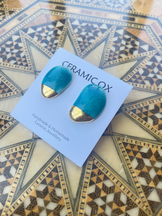 Aqua arched moulded studs