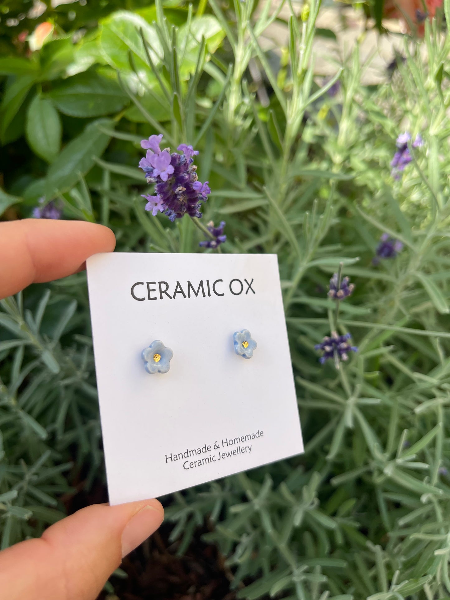 Tiny baby blue flower studs