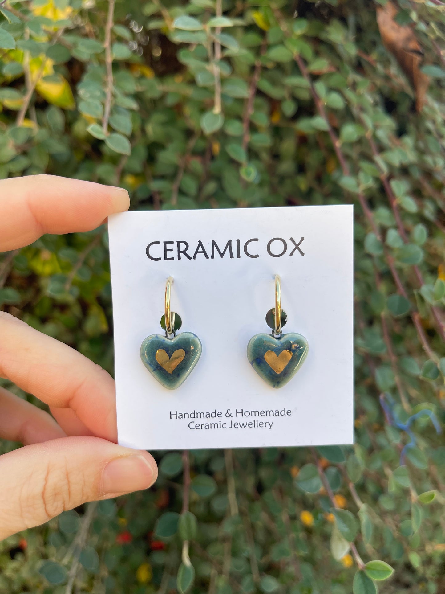 Heart danglies on hoop studs in Storm