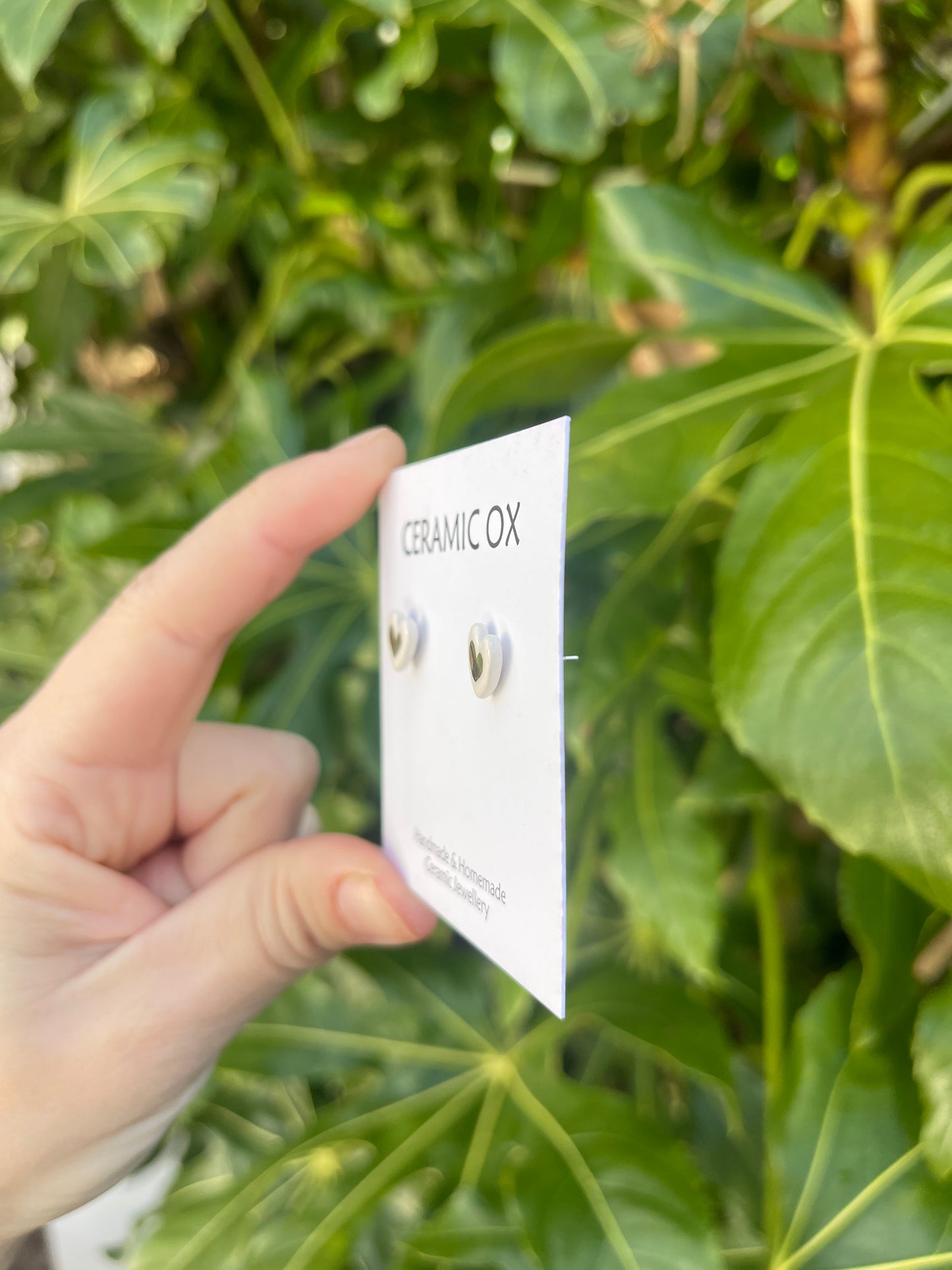 Tiny white heart studs