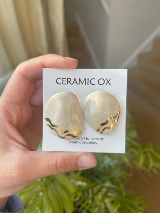 Asymmetric domed white studs - SECONDS SALE