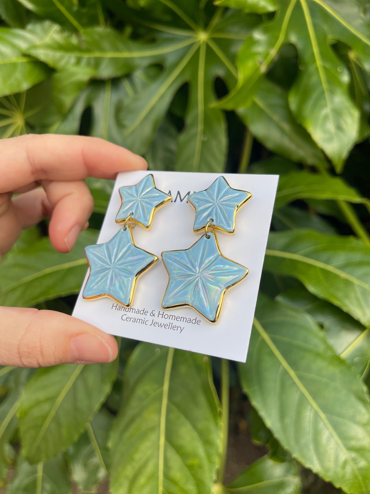 Double iridescent star dangle studs