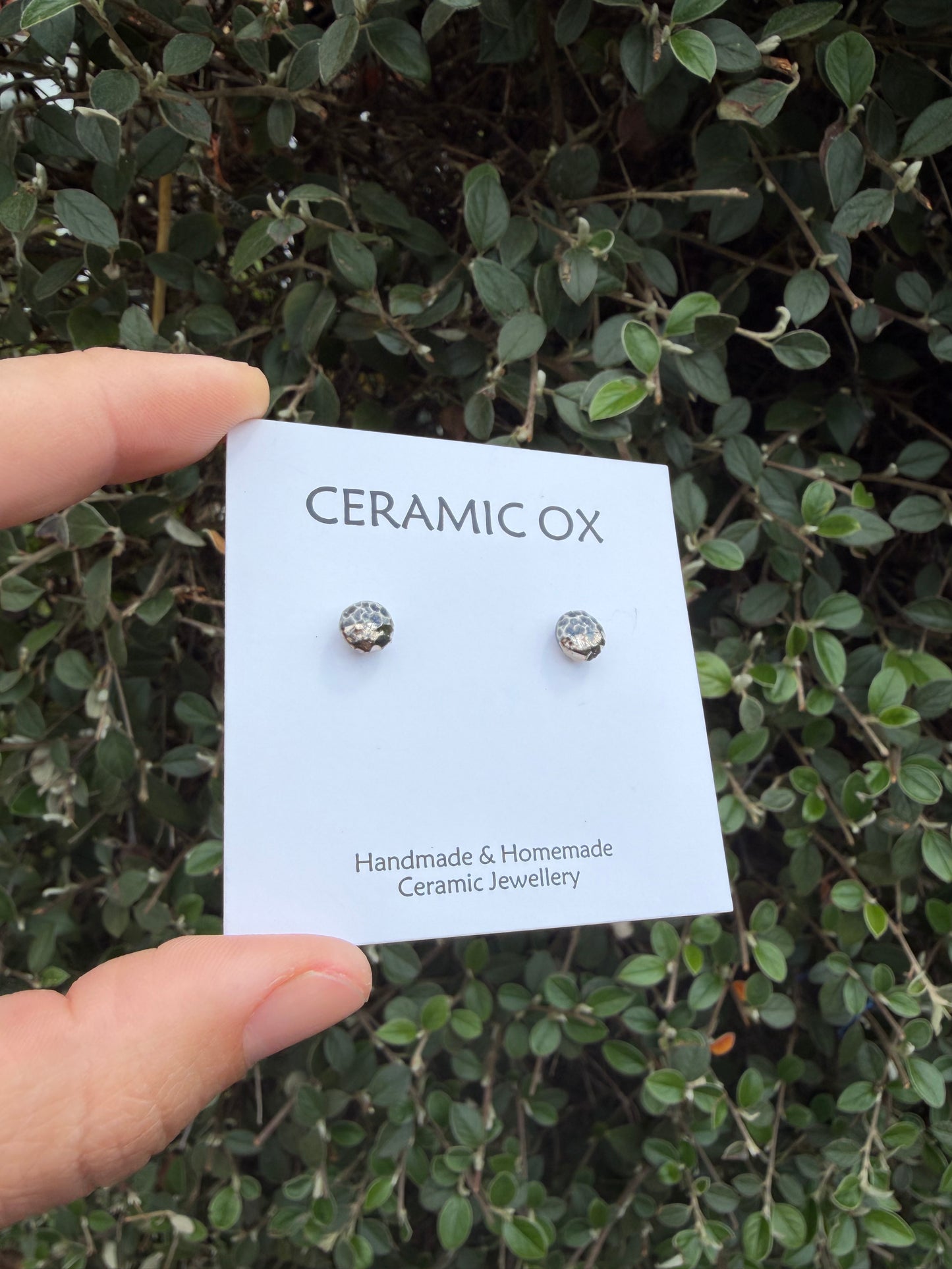 Tiny textured studs in grey black with platinum