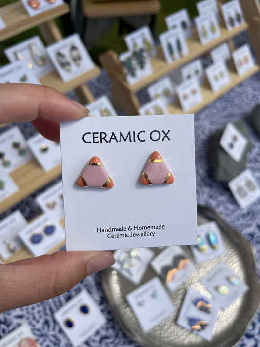 Small pink coral triangle studs