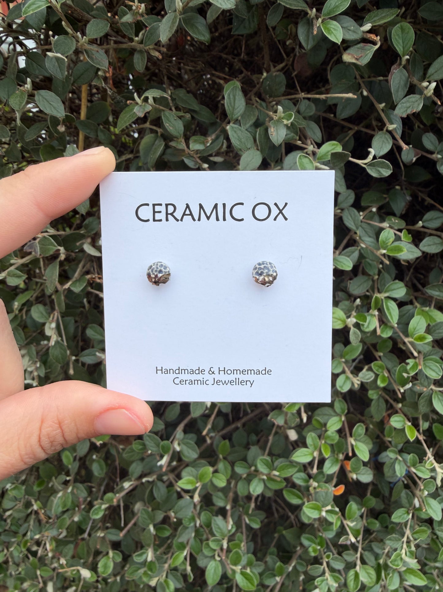 Tiny textured studs in grey black with platinum