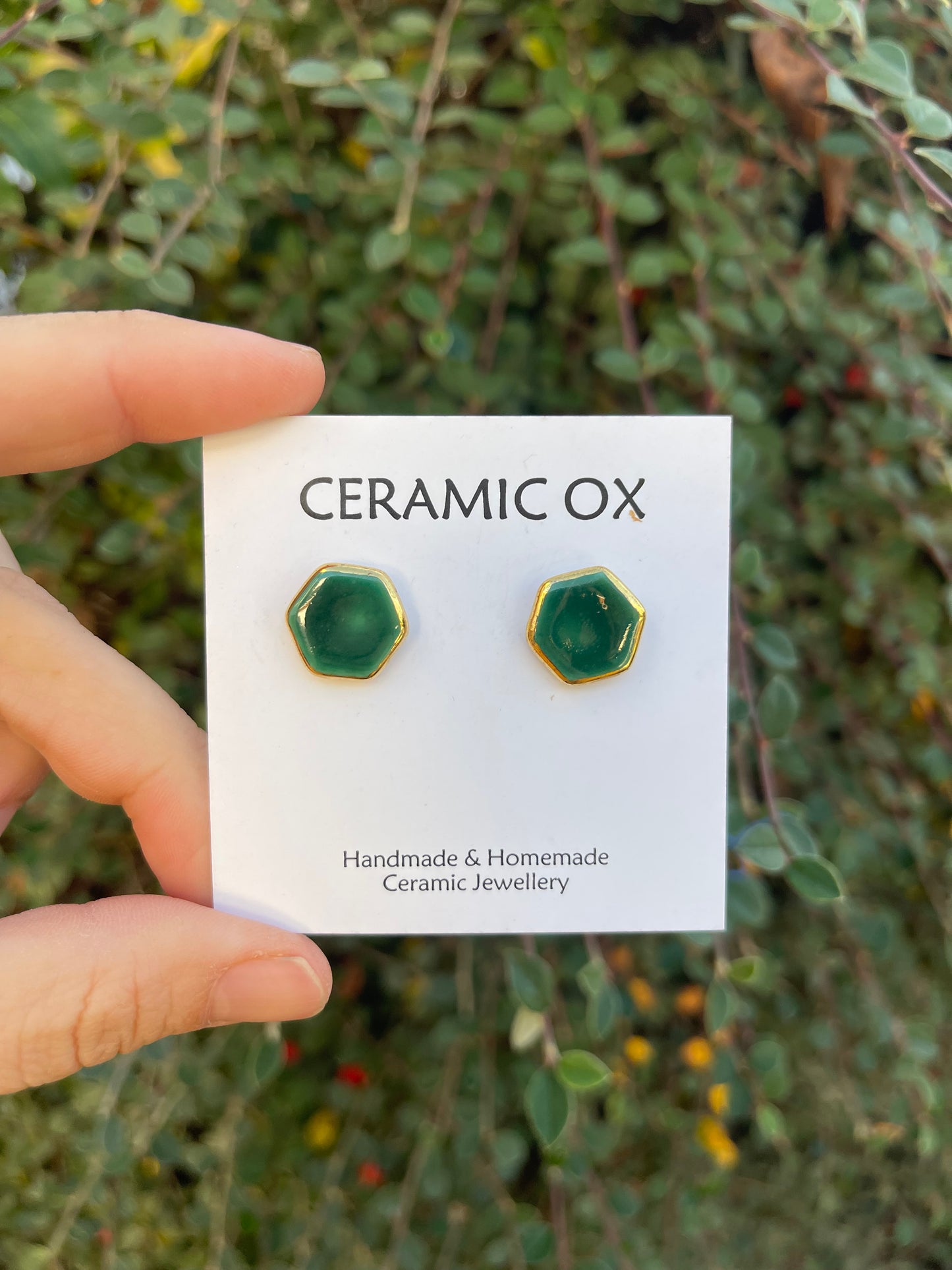 Emerald green hexagon studs