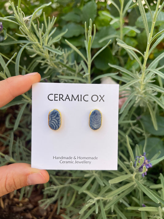 Imprint navy oval studs