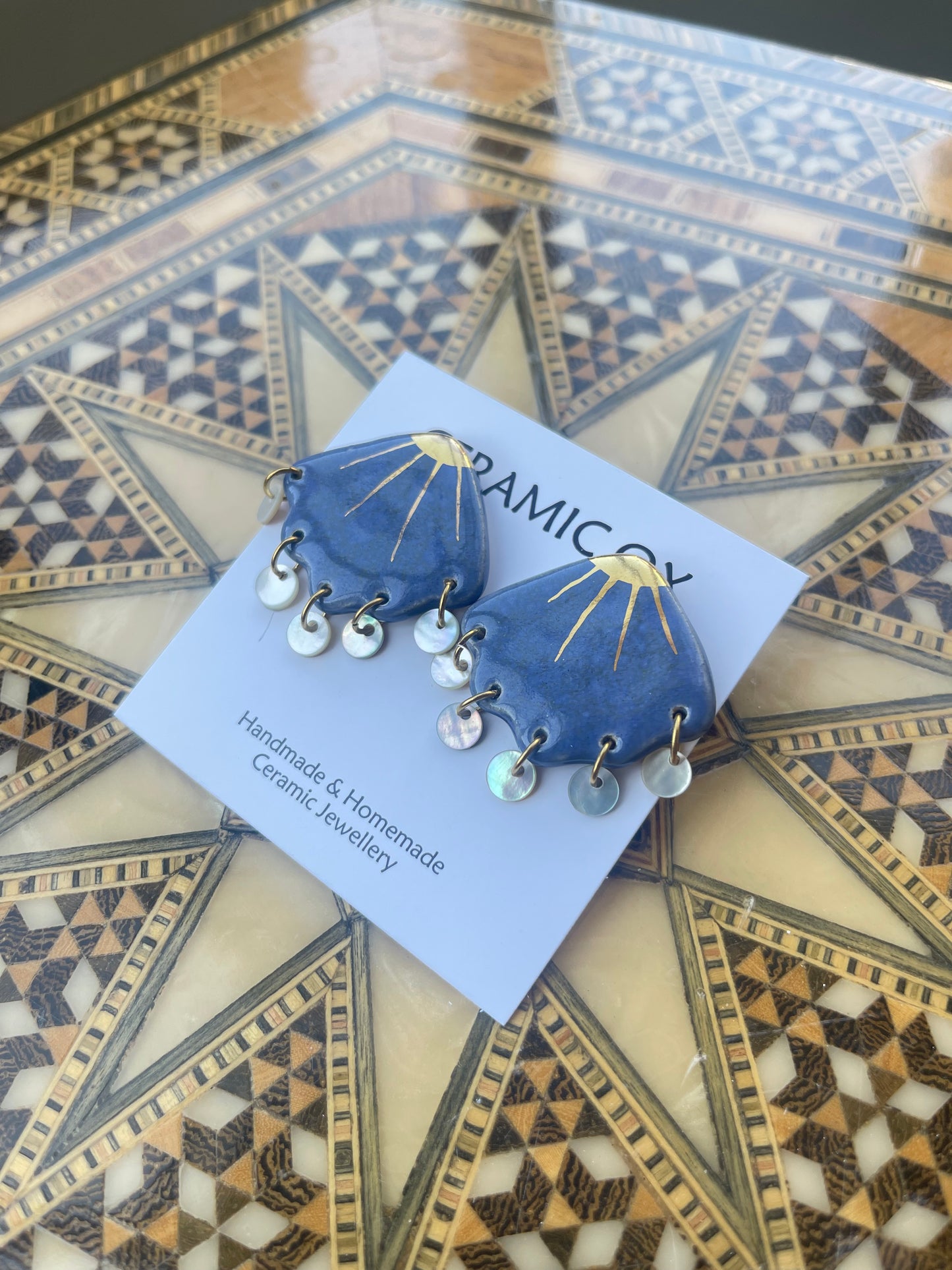Shell studs with mother of pearl drops