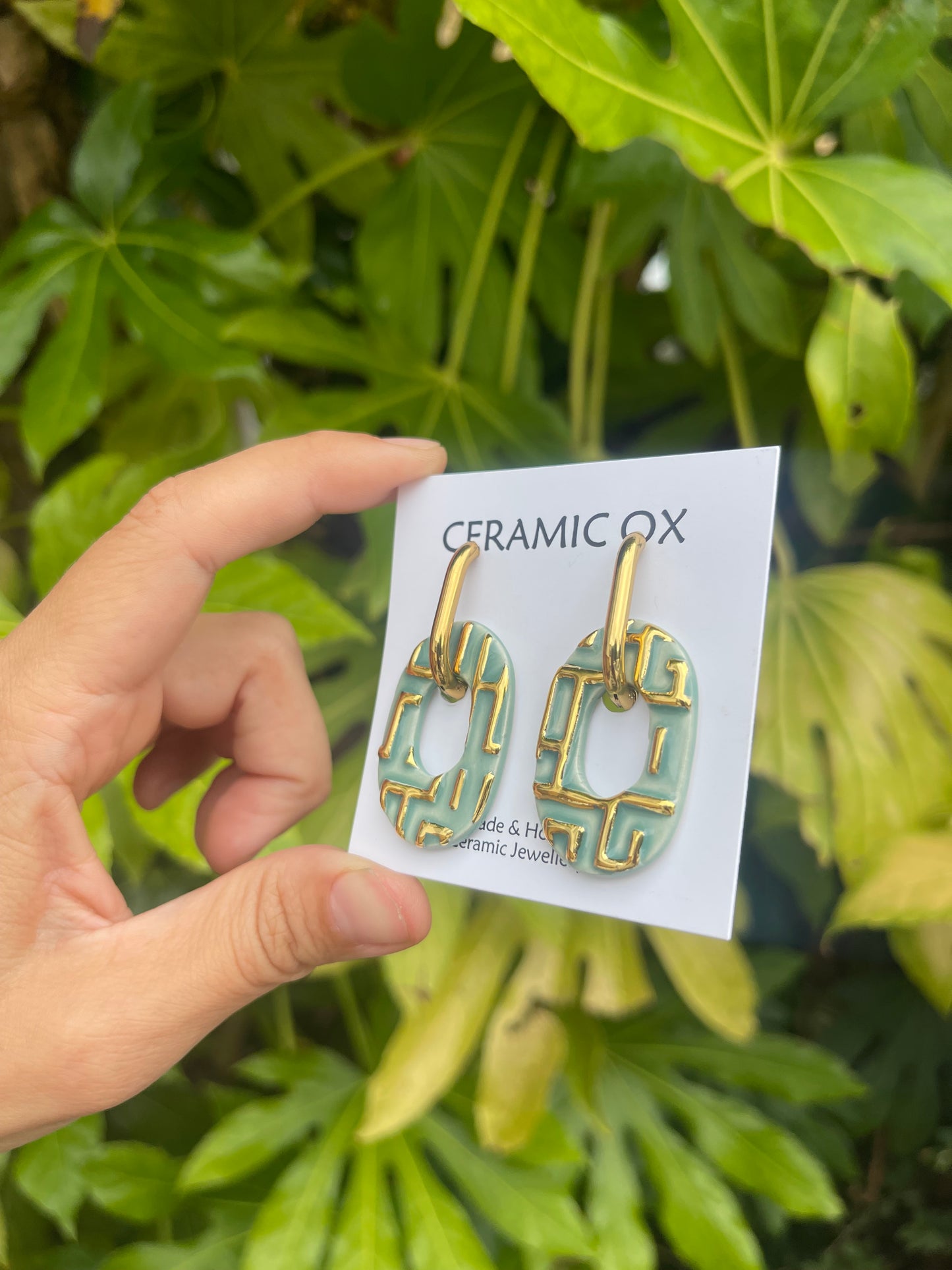 Jade patterned oval hoops
